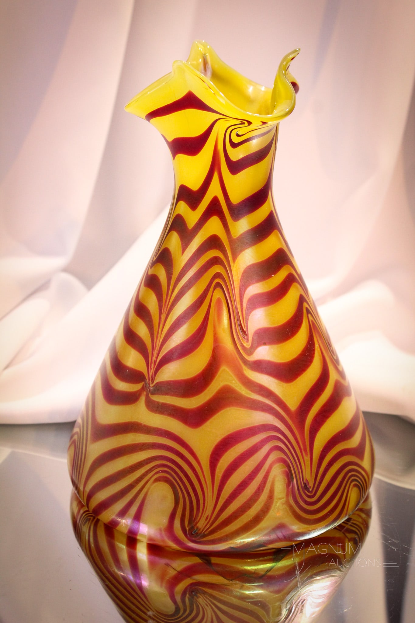 Attributed to Loetz Art Glass Vase Unknown Décor: This a possible unknown attributed to Loetz vase. Yellow and red metallic design with irridized finish. Measures 9" tall.