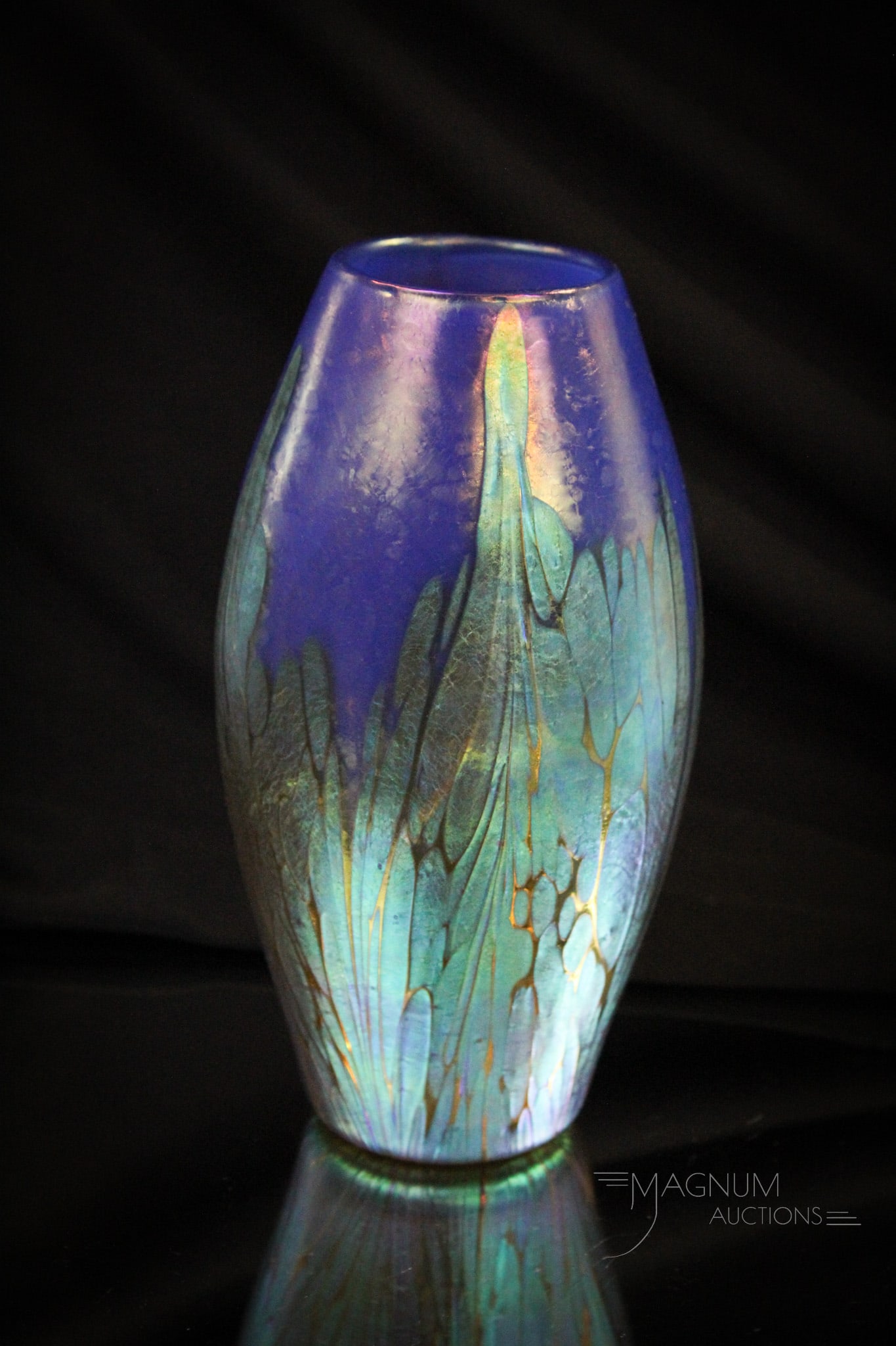 Electric Blue Irridescent Loetz Medici Blue Opal Vase circa 1902: Fine offering of a Loetz electric blue Loetz Medici opal vase. Circa 1902. Vase measures 7" tall.