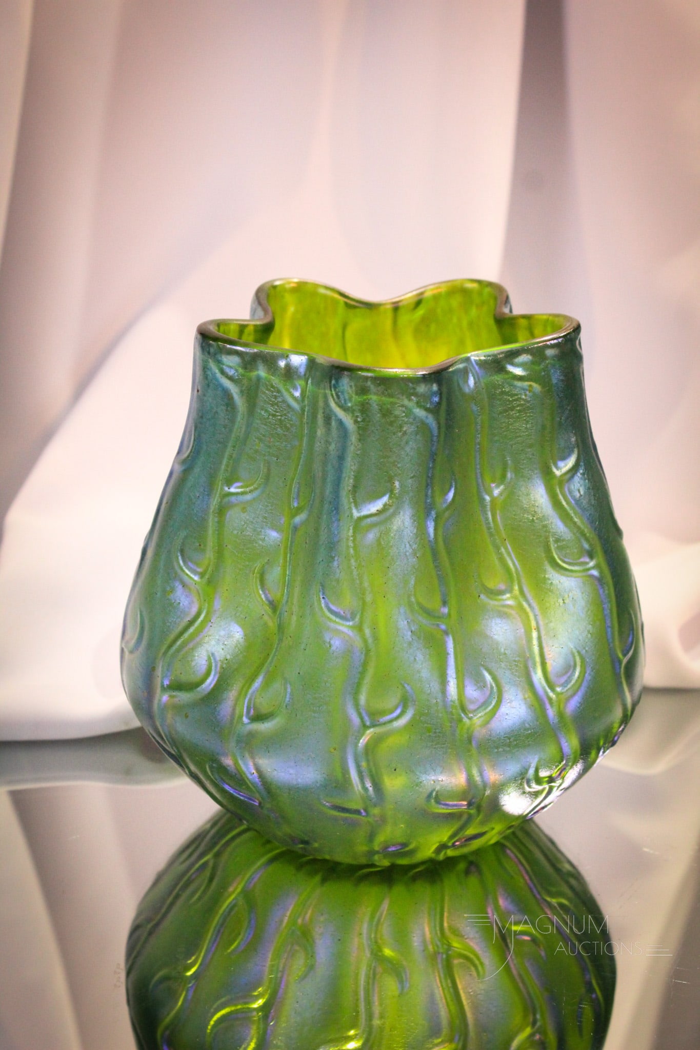 Loetz Neptune Art Glass Vase Circa 1903: Electric irridescent compliments this Loetz Neptune art glass vase. Piece is circa 1903. Measures 6 1/2".