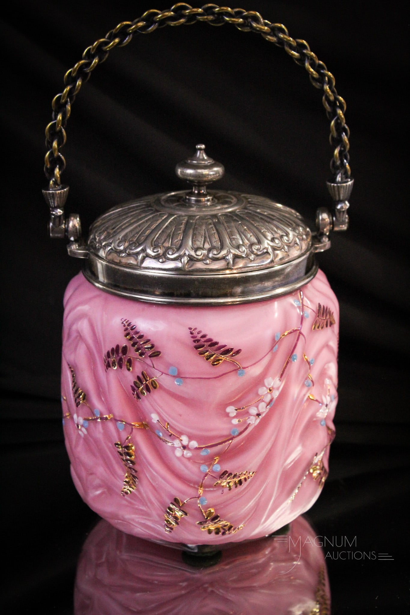 Victorian Ornate Drapery Art Glass Biscuit Jar: Amazing Victorian glass mauve cased gilt enameled biscuit jar. Superior metal mounts only add to this fine piece of art glass. It measures 7 1/4" tall.