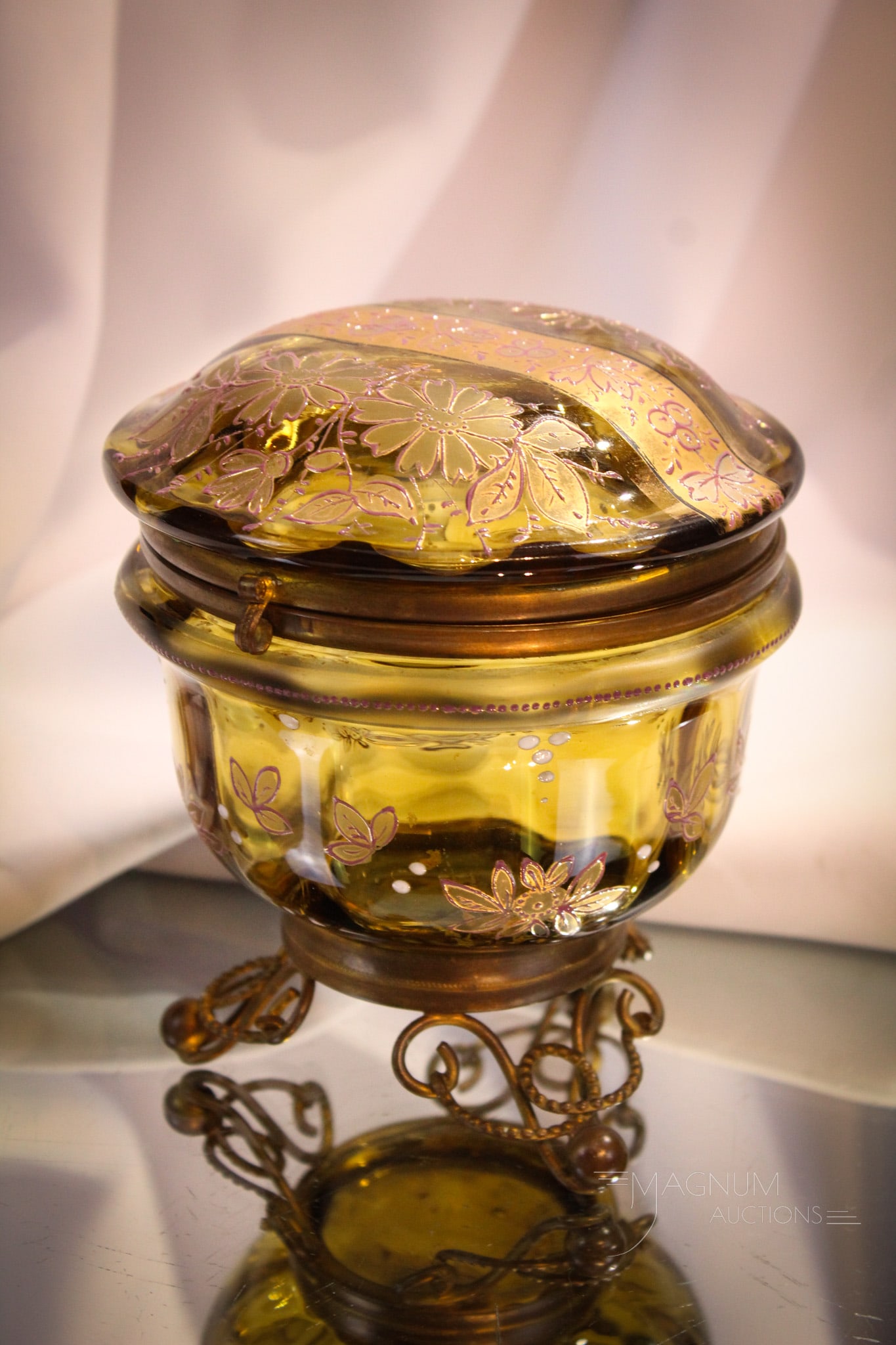 Victorian Enameled Art Glass Jewelry Casket: Fine Pooh Bear honey amber Victorian gilt and enameled jewelry casket with fancy gold feet. Complete it measures 5 1/2" tall, 4 3/4" wide.