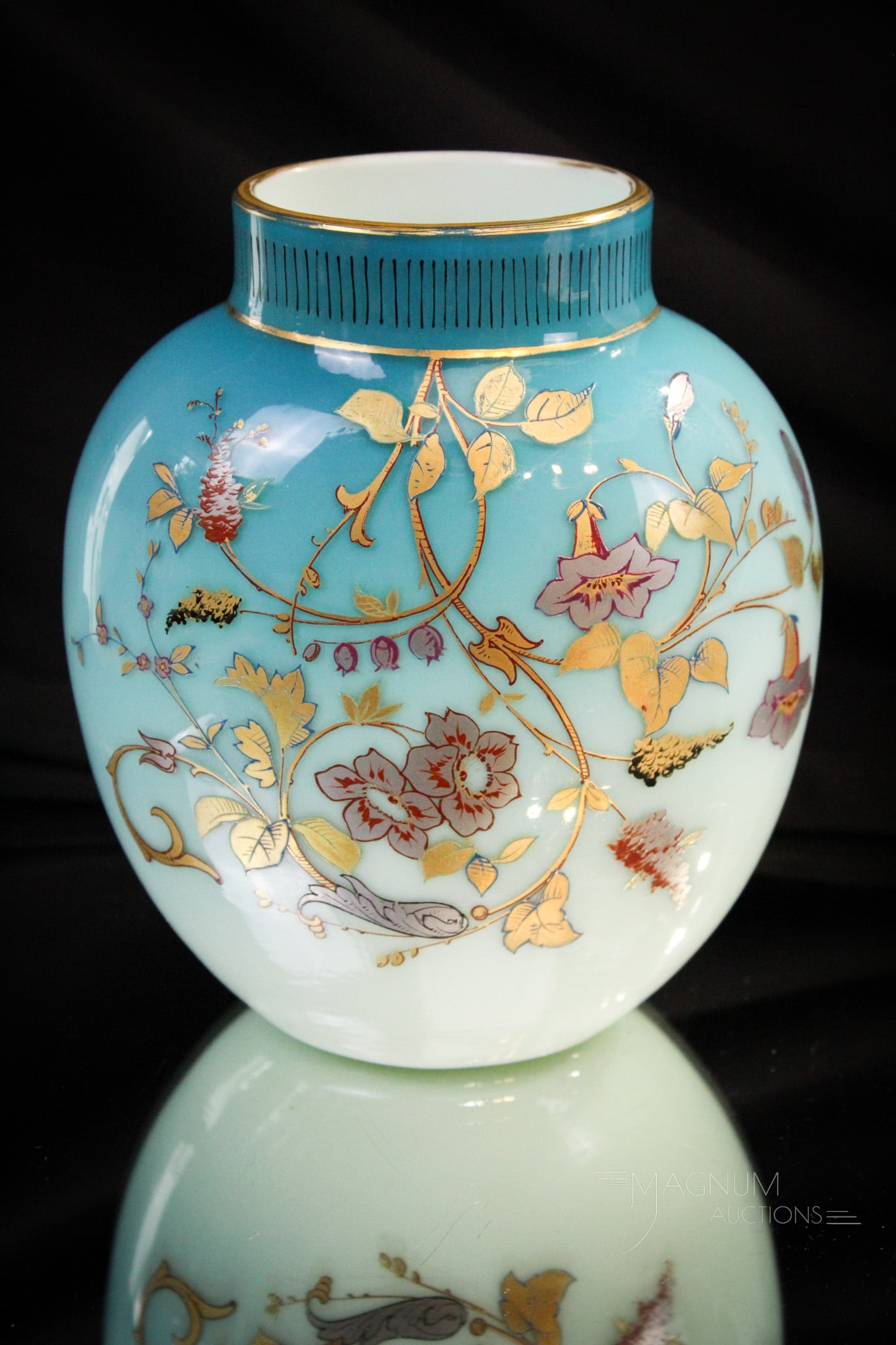 Signed Harrach Uranium Glass Victorian Gilt Decorated Vase: Nice find in this signed with propellor mark Harrach aqua cased glass vase. This lights up under black light like no other! Measures 6 1/4" tall.