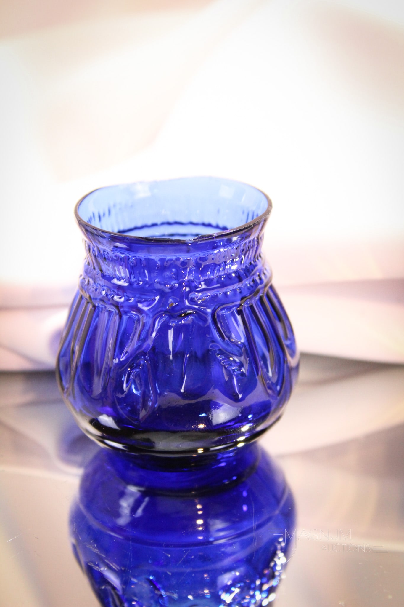 Cobalt Victorian Pleated Cotton Bag Victorian Toothpick Holder: Great vivid coloring to this cobalt blown glass Victorian toothpick holder in the form of a pleated bag of cotton. Measures 2 1/4" tall.