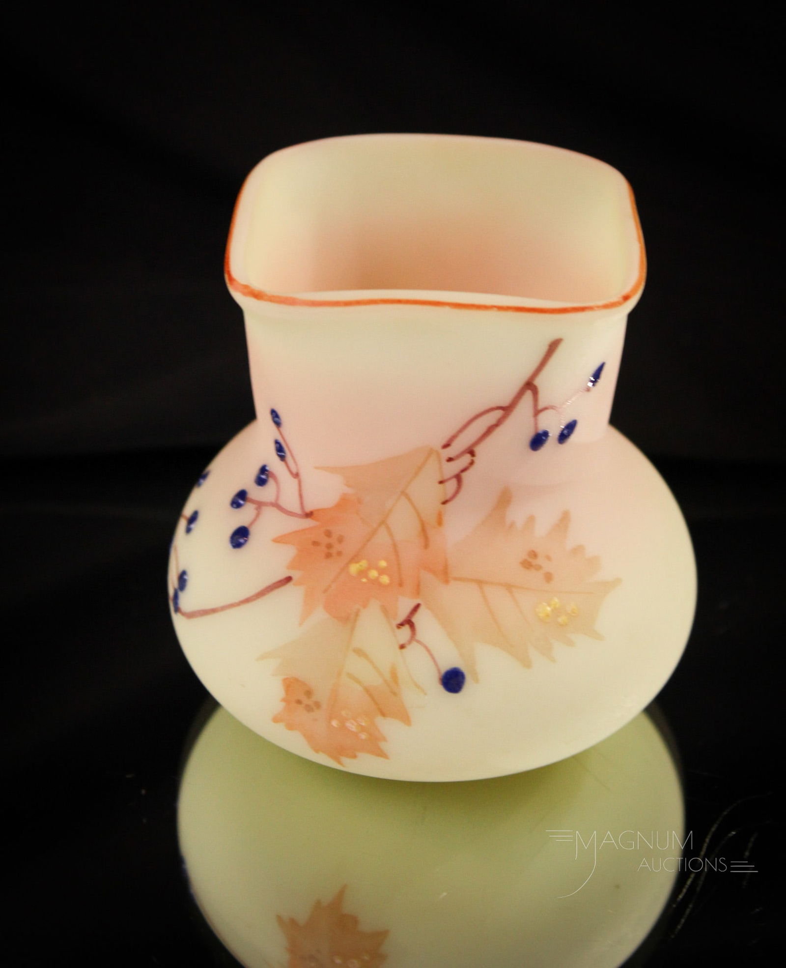 Mt. Washington Burmese Glass Decorated Victorian Toothpick Holder: Desirable example of a Mt. Washington burmese glass Victorian toothpick holder with blue berry and leaf decoration. This measures 2 3/4" tall.