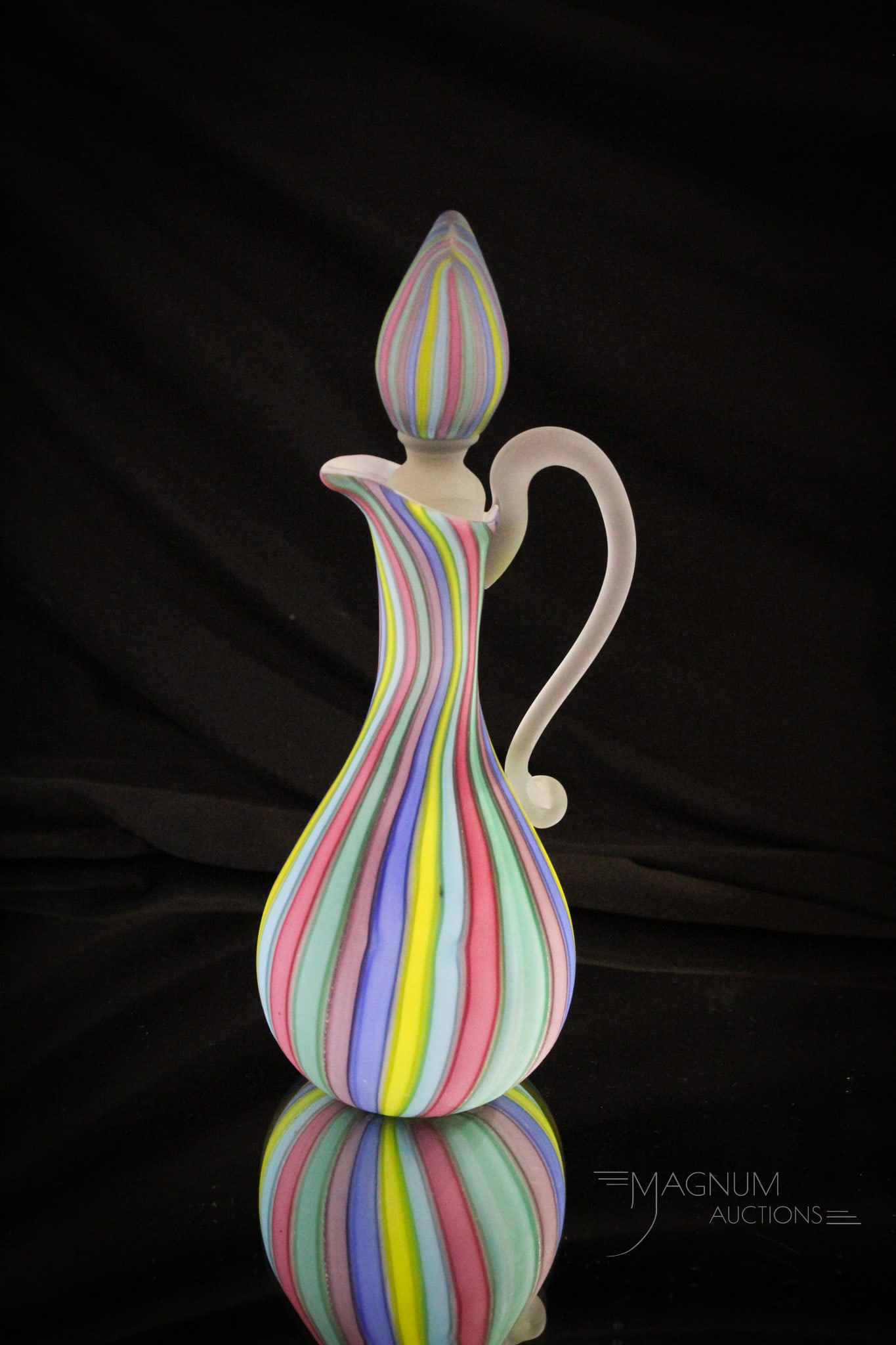 Italian Murano Glass Rainbow Mother of Pearl Cruet: Fine offering of an Italian Murano made art glass tumbler in rainbow satin diamond quilt glass. Measures 8 3/4" tall.