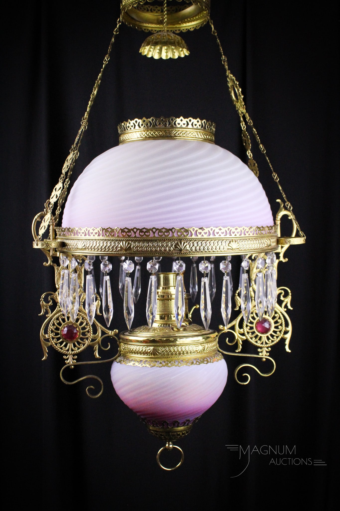 Victorian Pink Opal Satin Swirl Jeweled Hanging Parlor Lamp: Nice find here in this hanging Victorian Parlor lamp. Lamp frame features inset jewels. Complete with matching shade and font in vibrant shaded pink opal swirl in rich satin finish. Measures 40" long 