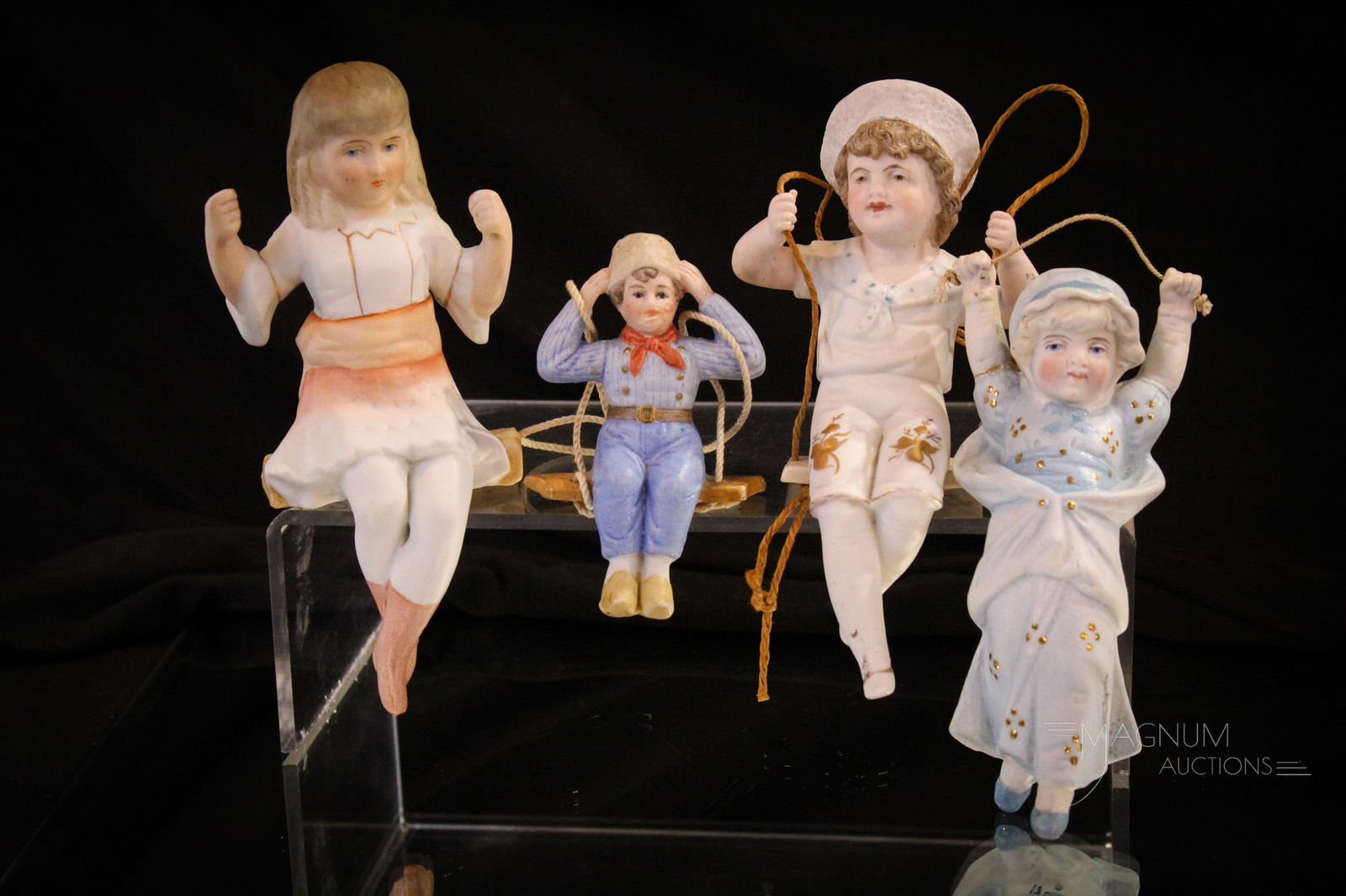 4 pc Lot Victorian Bisque parlor Oil Lamp Swingers: Four select examples in this lot of Victorian bisque swingers. Each as nice as the next. Largest measures 6" tall.