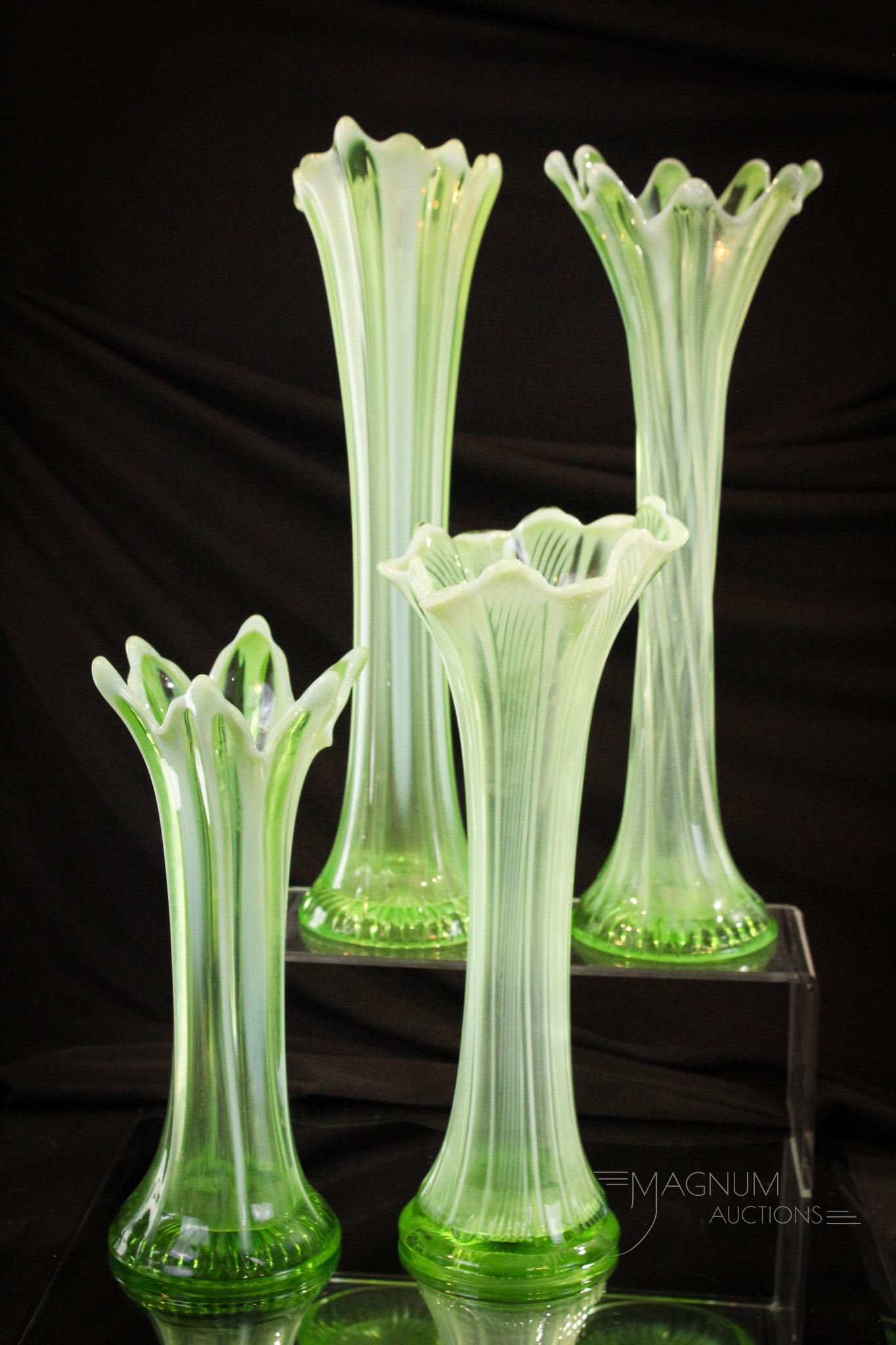 4 pc Lot Green Opalescent Victorian Glass Swung Vases: Select offeing of four green opalescent Victorian swung vases. The patterns include Wide Rib, Spiralex, Plain Panels, and Twister. Tallest measures 14".