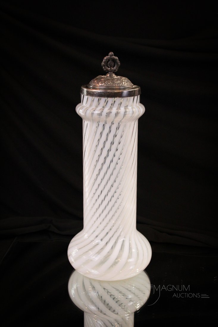 Victorian Opalescent Swirl Straw Jar: So hard to find one of these Victorian glass opalescent straw jars. This one in opalescent swirl pattern complete with silverplate associated lid. It measures 12" tall.