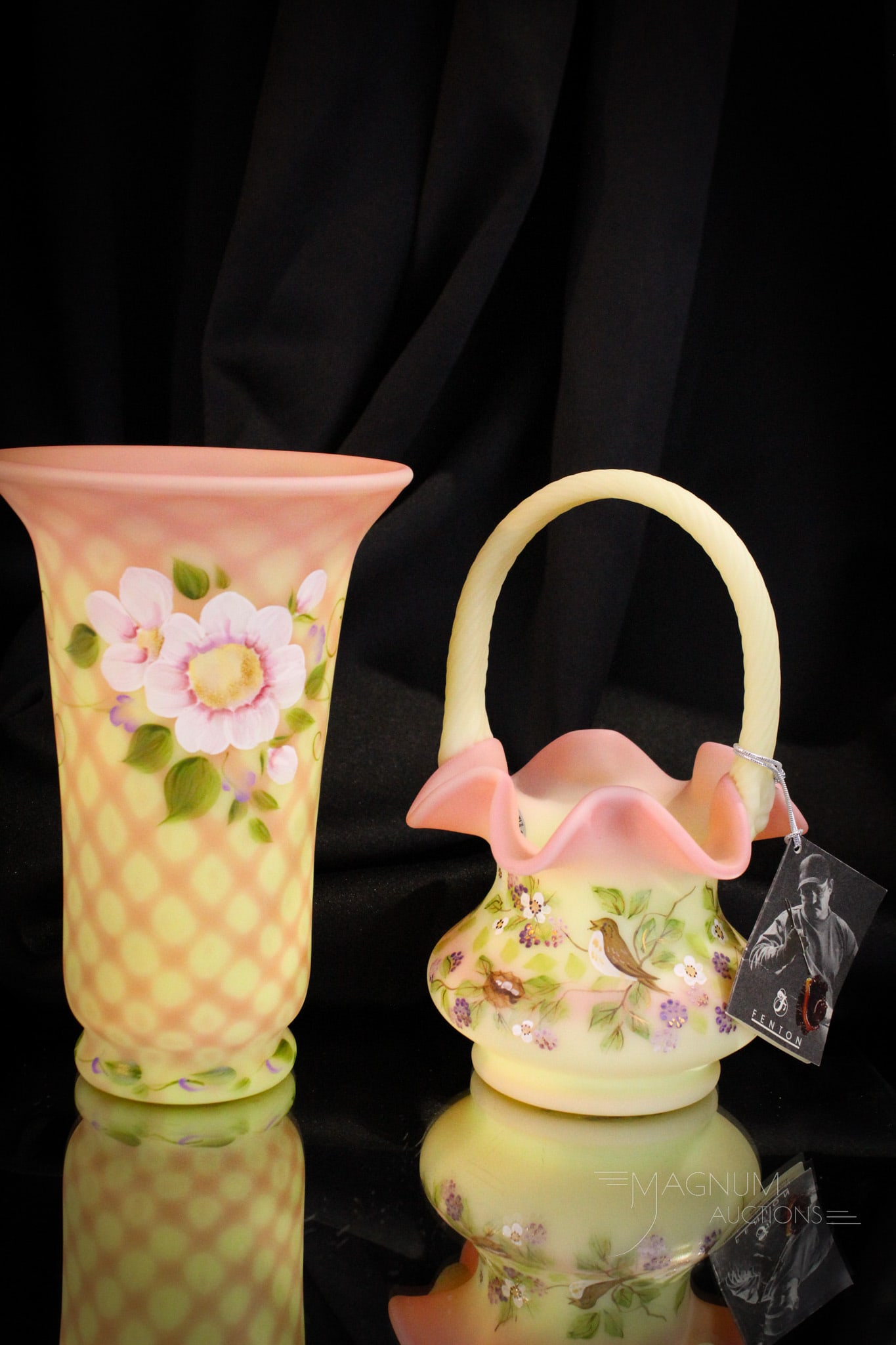 2 pc Lot Fenton Burmese Hand Painted Art Glass: Two fine pieces of Fenton hand painted burmese art glass. A super lattice vase along with a bird and blackberry basket. Tallest measures 8" tall.