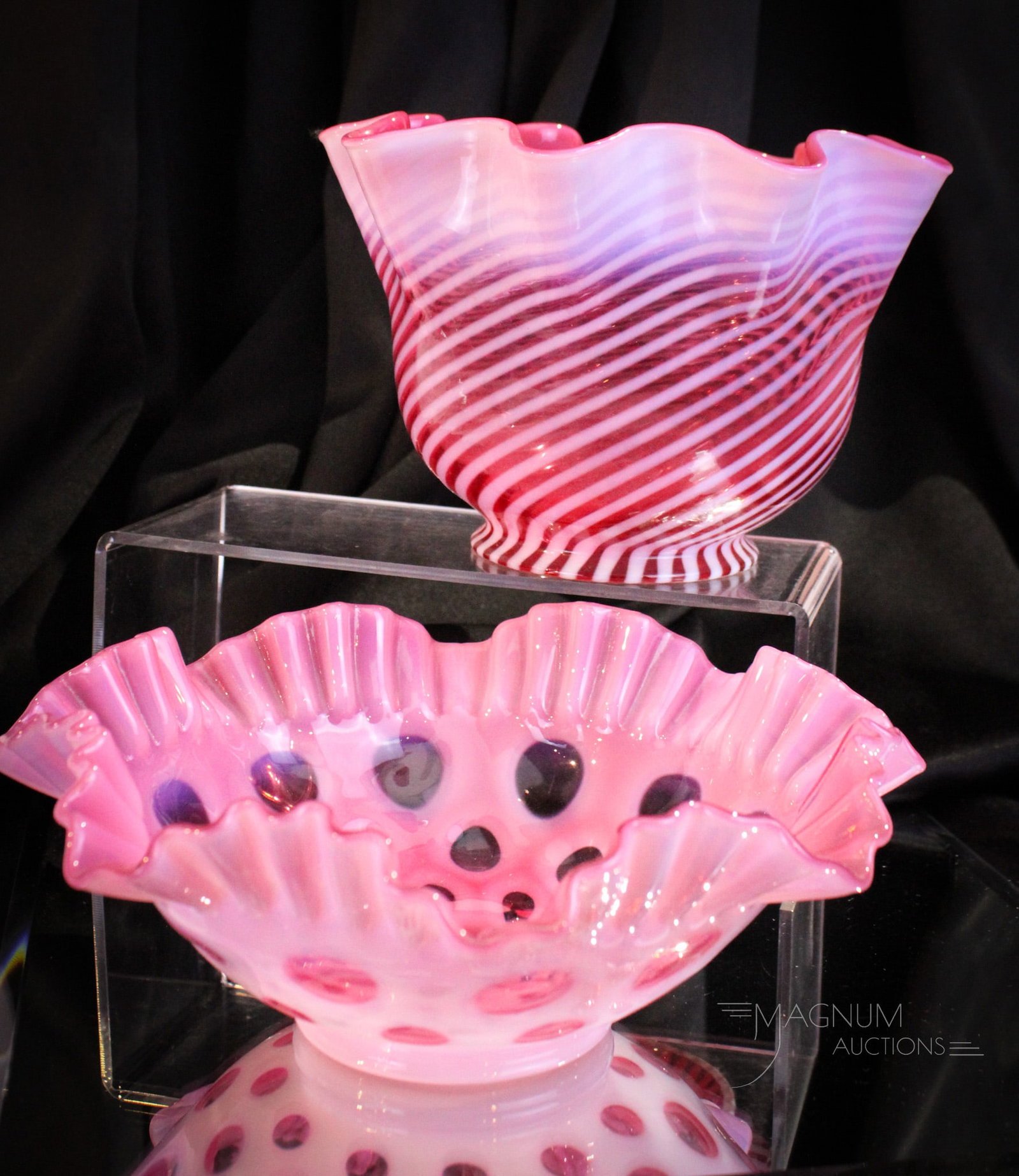 2 pc Lot Fenton Art Glass Shade & Bowl: Two lovelies here folks. A bowl in cranberry opal coin dot along with a cranberry spiral opal lamp shade. Shade measures 5 3/4" tall, 8 1/2" wide, and 4" fitter. Minor fitter rim chip as shown.