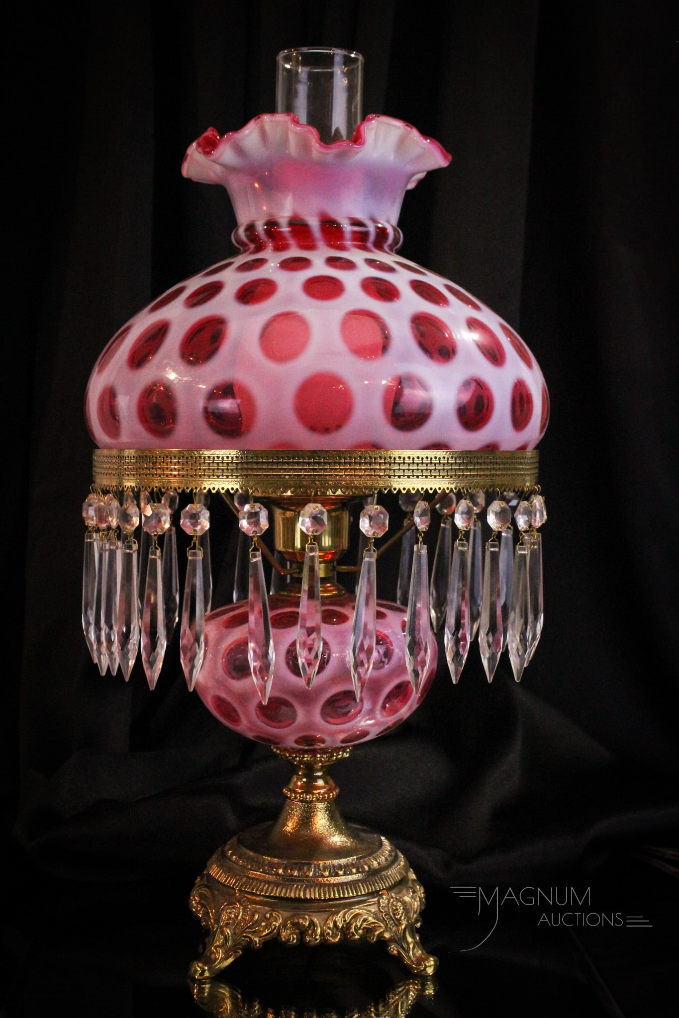 Fenton Cranberry Opalescent Coin Dot Table Lamp: Amazingly wonderful cranberry opalescent Fenton Coin Dot pattern table lamp complete with prisms. Lamps stands tall at 19".