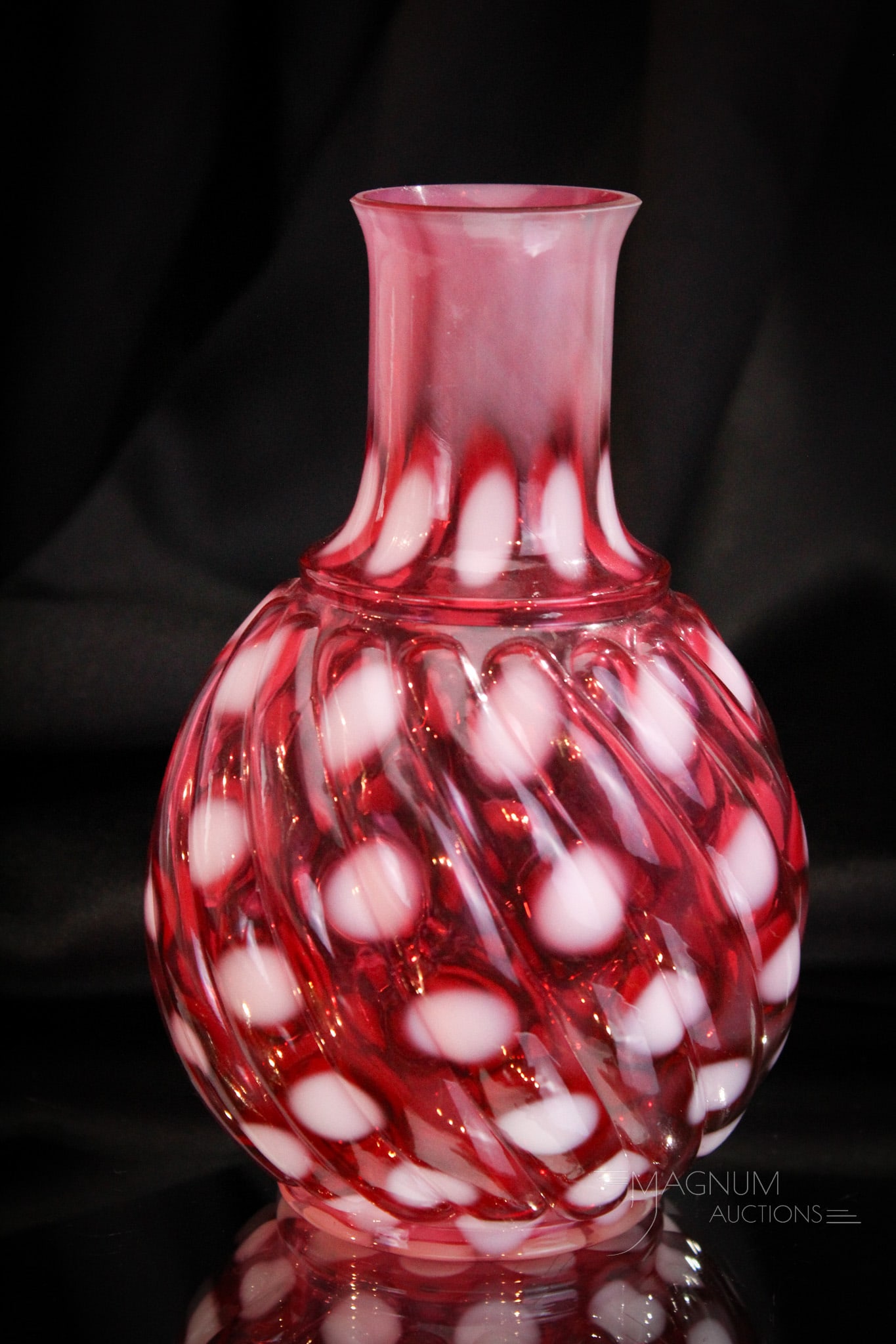 Very Rare Buckeye Swirl Mold Cranberry Opalescent Water Caraffe: Folks this is a truly rare piece. This caraffe is in the Buckeye Big Windows swirl mold with an opalescent coin spot pattern. Great coloring and opal and so rare. Measures6 3/4" tall.