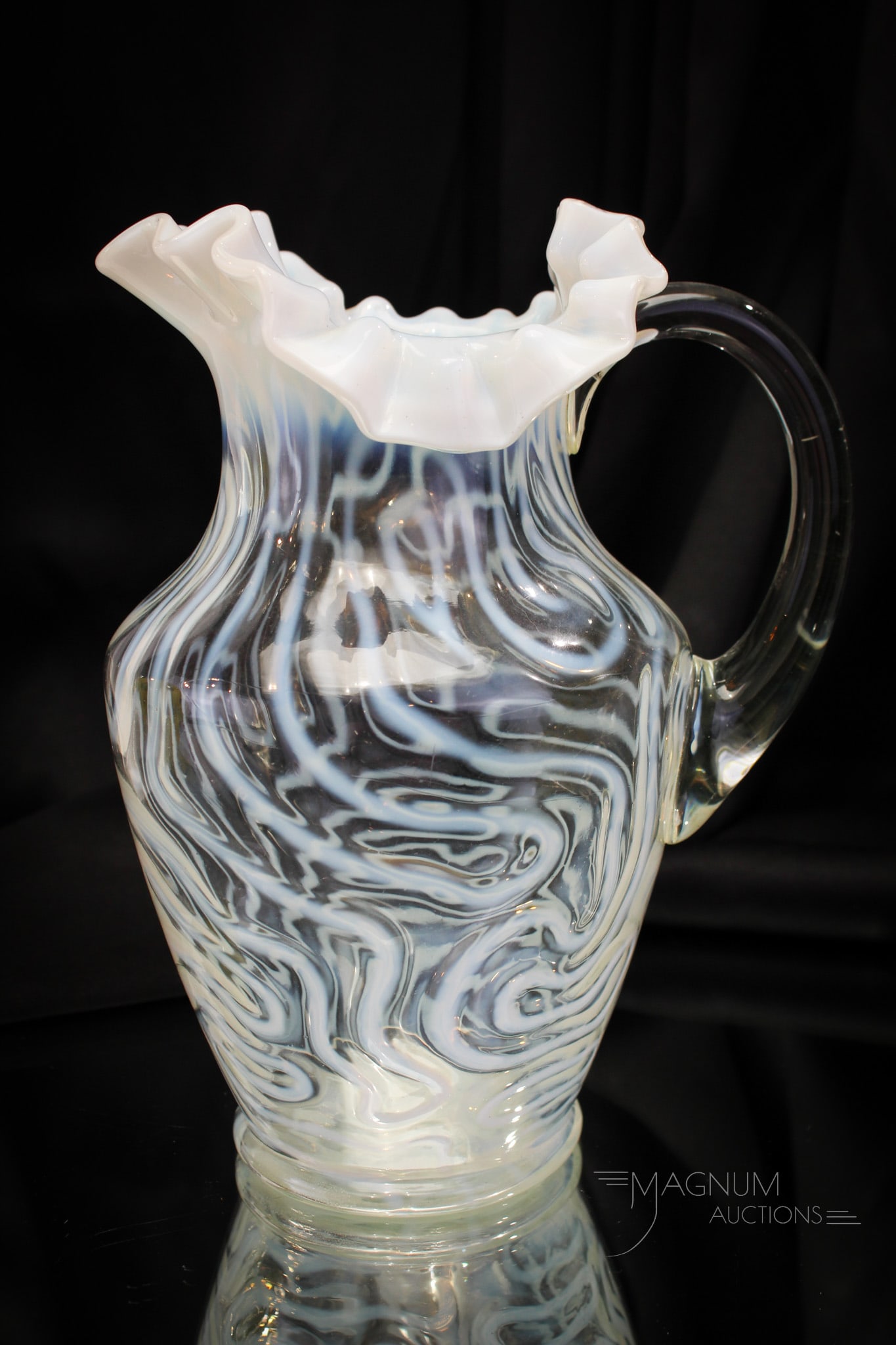 Jefferson Swirling Maze Opalescent Victorian Water Pitcher: Fine Victorian Jefferson Swirling Maze pattern Victorian water pitcher. This one in crystal opalescent. Pitcher measures 9 3/4" tall. In-the-making line to handle at top application terminal.