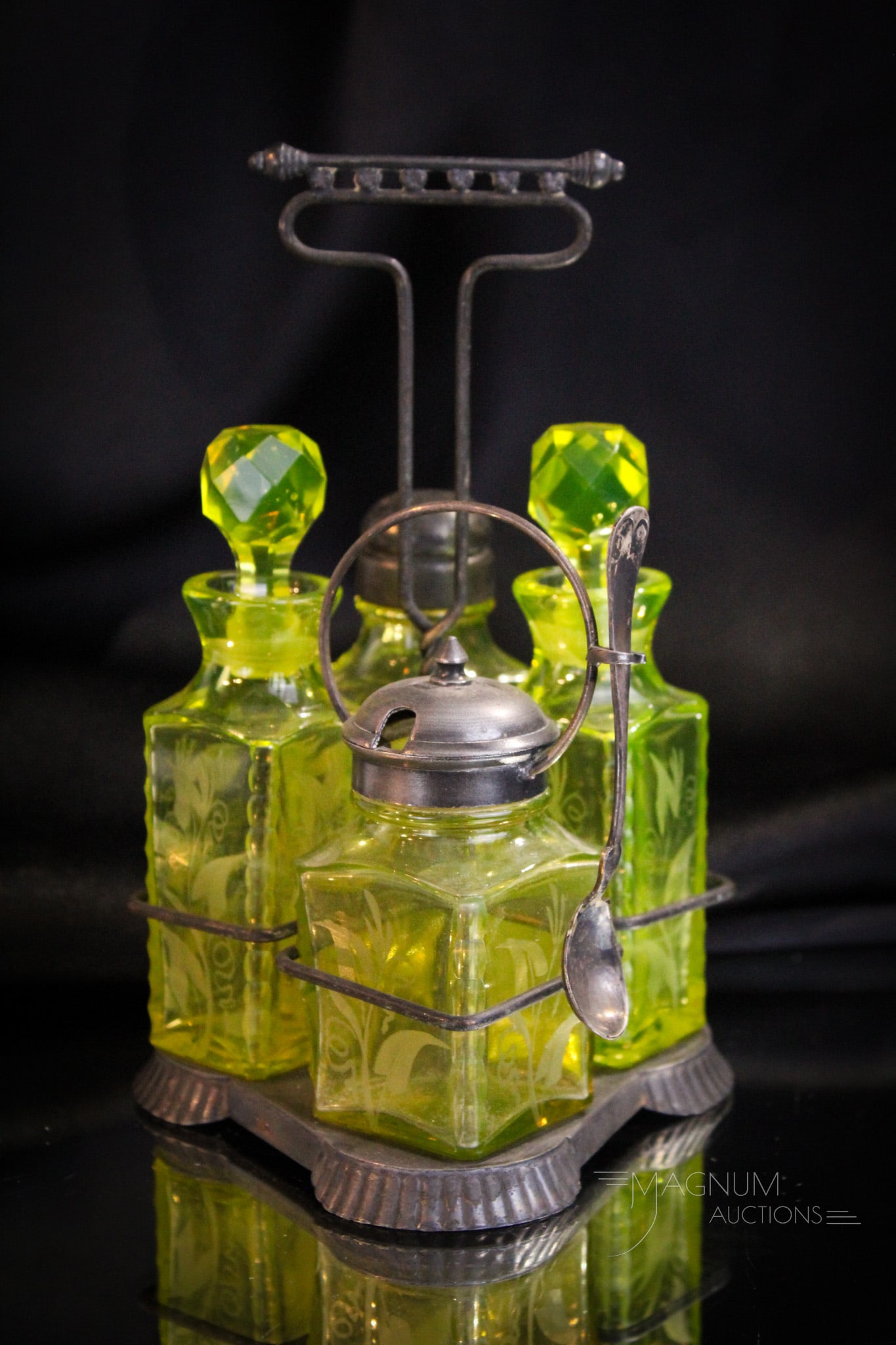 Pairpoint Vaseline Engraved Glass Silverplate Condiment Set: Pairpoint Silverplate condiment set complete with vaseline Pairpoint bottles. Each engraved with floral design. Such a nice set with vivid coloring. One shaker with high point minor roughness and the