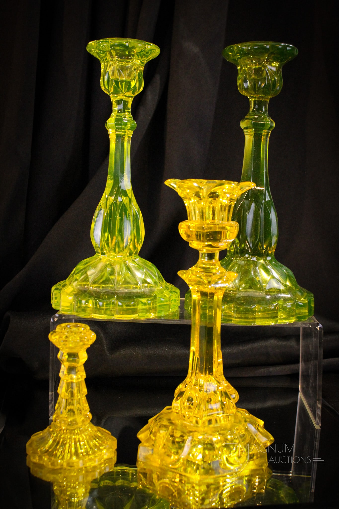 4 pc Lot Victorian Vaseline Flint Glass Candlesticks: Super four piece lot of flint glass Victorian candlesticks. One pair as far as pattern goes but different coloring. All nice examples. Tallest measures 10".