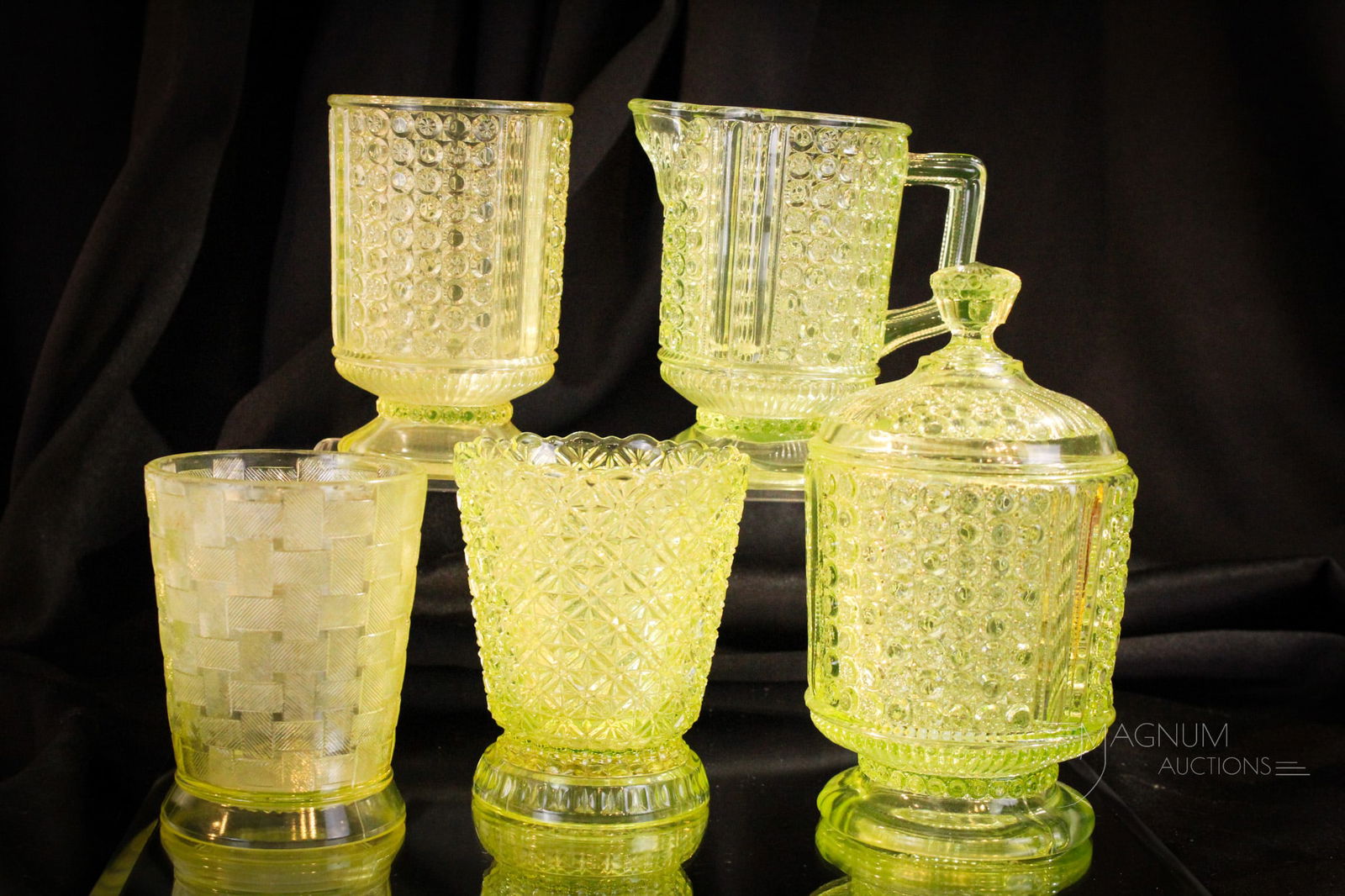 5 pc Lot Vaseline Glass: Three selections in the Two Panel pattern to include a covered sugar, a spooner, and a creamer. Sugar lid with inner rim flange chips. All this along with two other spooners.