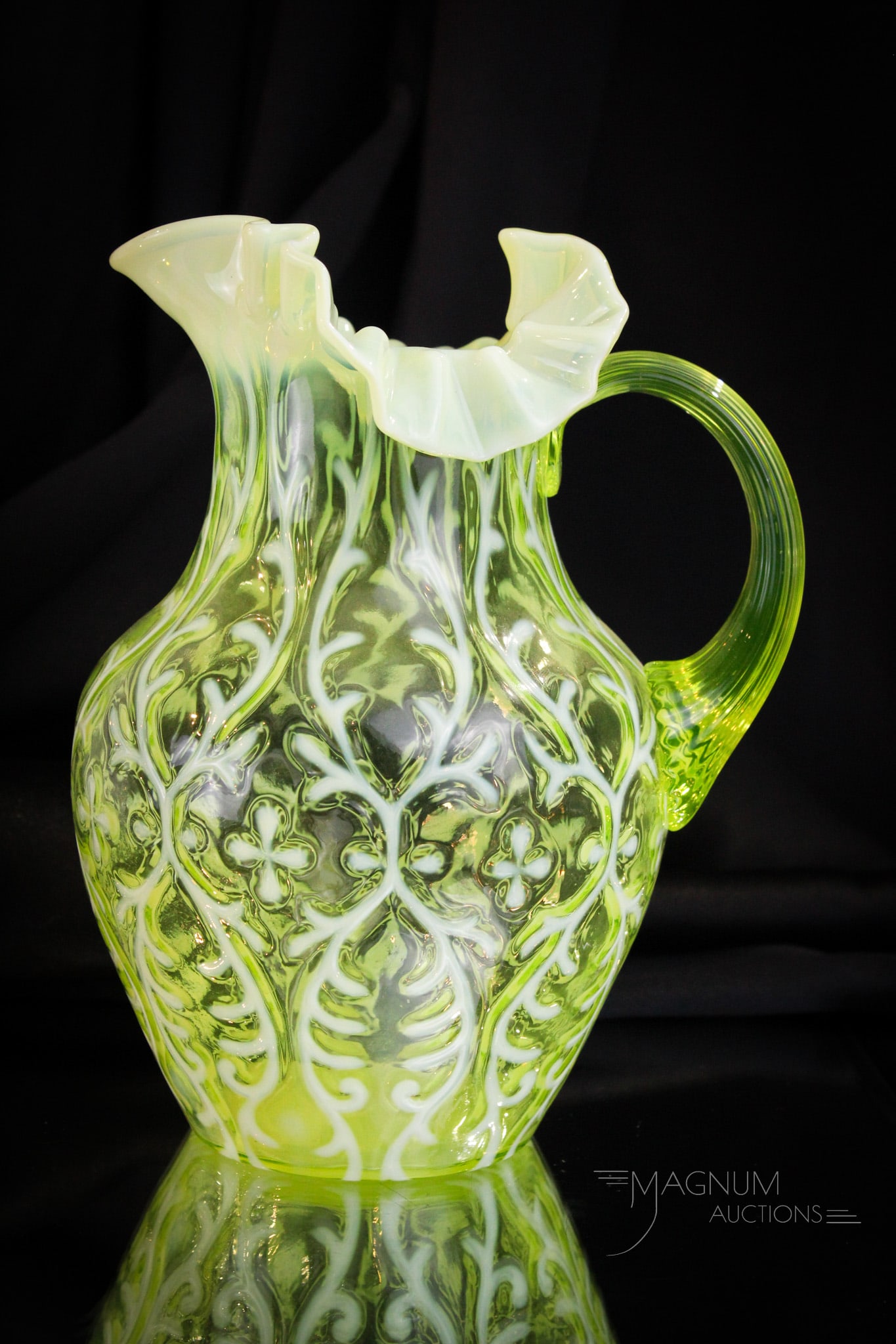 Northwood Vaseline Opalescent Spanish Lace Victorian Water Pitcher: Beautiful example of a Northwood vaseline opalescent Spanish Lace Victorian water pitcher. This one with strong color and opalescence. Pitcher measures 9 3/4" tall.