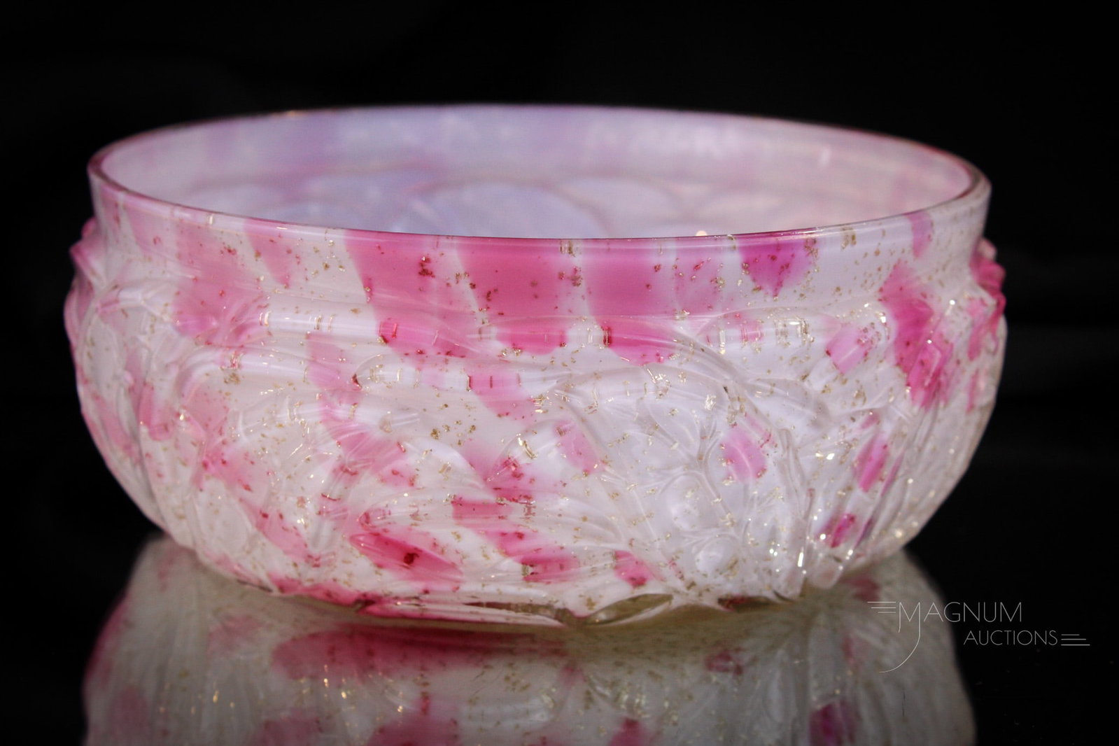 Northwood Leaf Mold Victorian Cranberry Spatter Master Berry Bowl: Seldom seen Northwood Leaf mOld pattern master berry bowl in cranberry and mica spatter cased glass. Bowl has nice coloring and is in great shape. Bowl measures 3 1/4" tall, 8" in diameter.