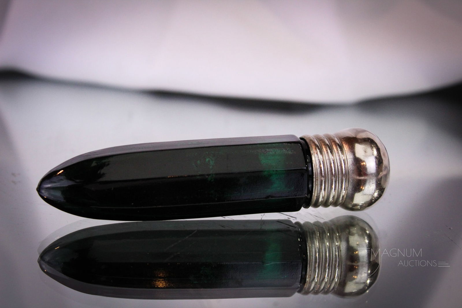 Emerald Green Victorian Cut Glass Perfume Scent Bottle: This Victorian perfume bottle in deep emerald green is exquisite. Bottle is cut and polished glass and complete with matching deep emerald green stopper. Silver lid is unmarked. Stopper is stuck perha