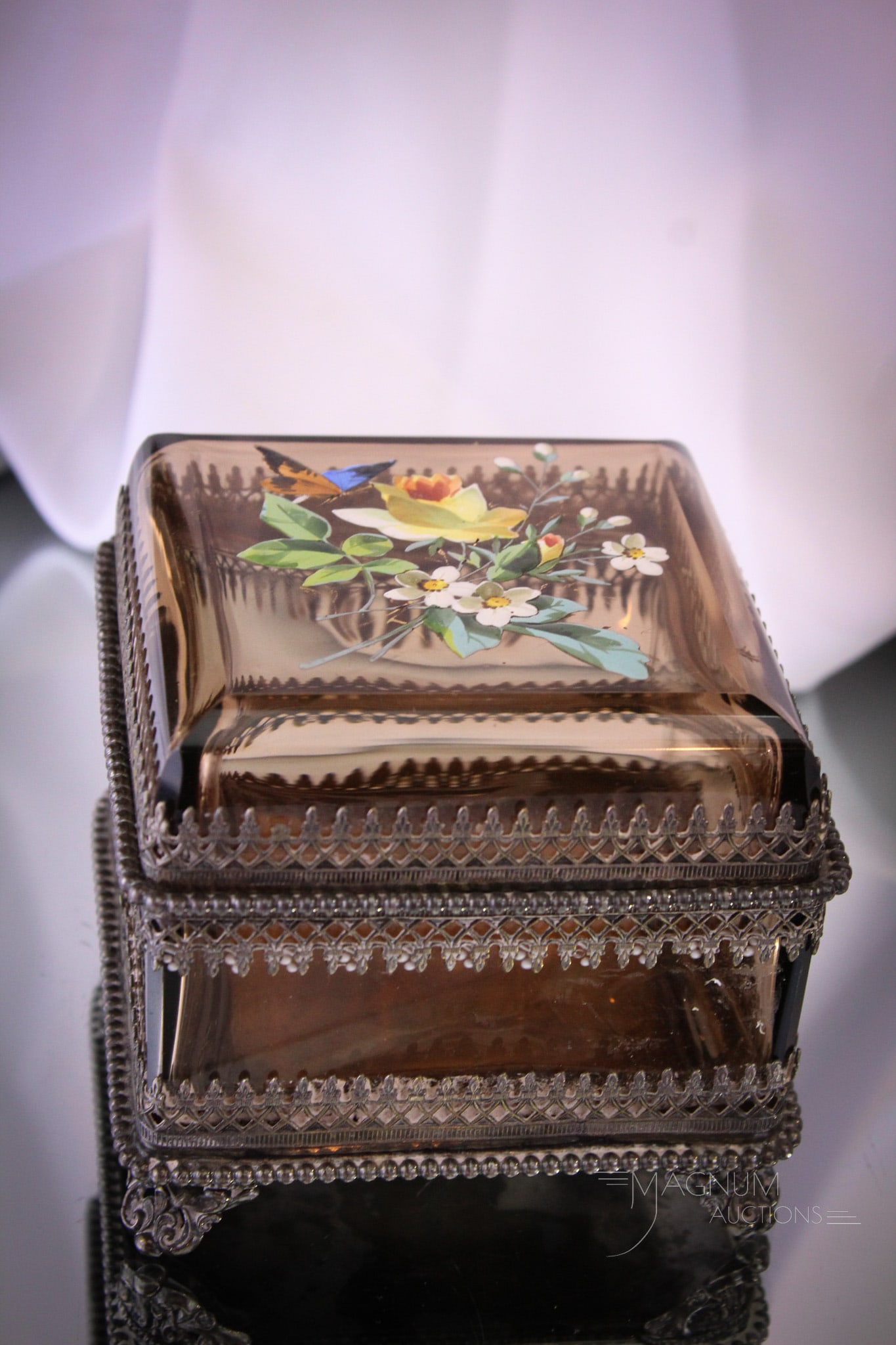 Forbes Silverplate Enameled Victorian Topaz Jewelry Casket: Select offering of Victorian signed Forbes silverplate jewelry casket complete with smoky topaz amber enameled glass body. Lovely box and exquisitely detailed. It measures 4" tall, 4 1/2" wide.