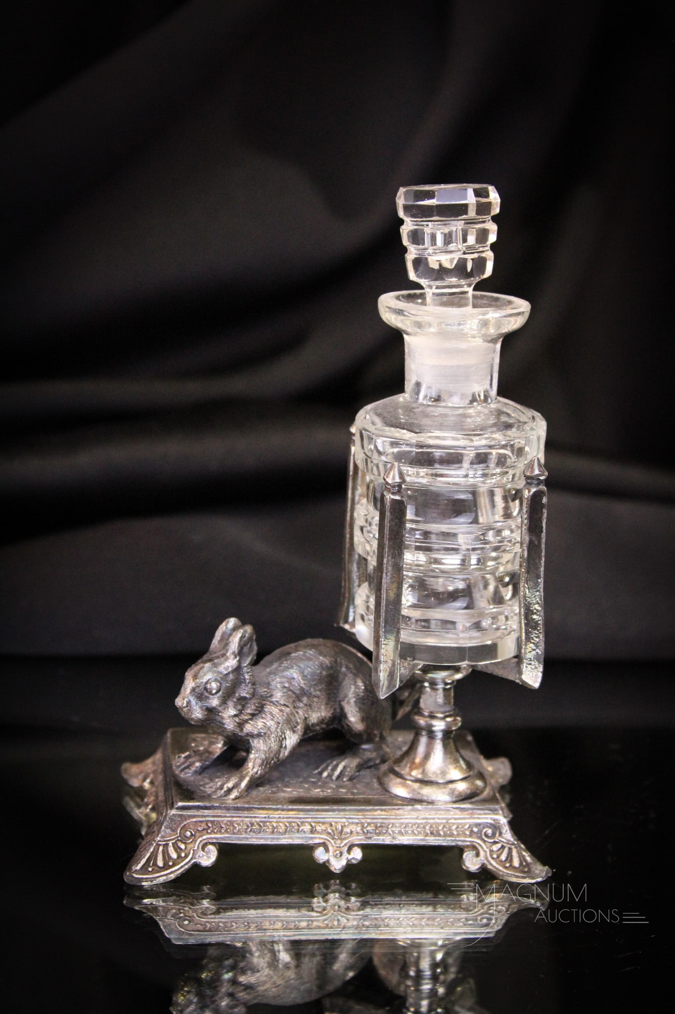 James Tufts Victorian Silverplate Figural Squirrel Perfume Castor: How cute is this one folks? This signed James Tufts silverplate Victorian perfume castor feaures a plump squirrel and clear perfume bottle. Piece measures 6" tall complete.