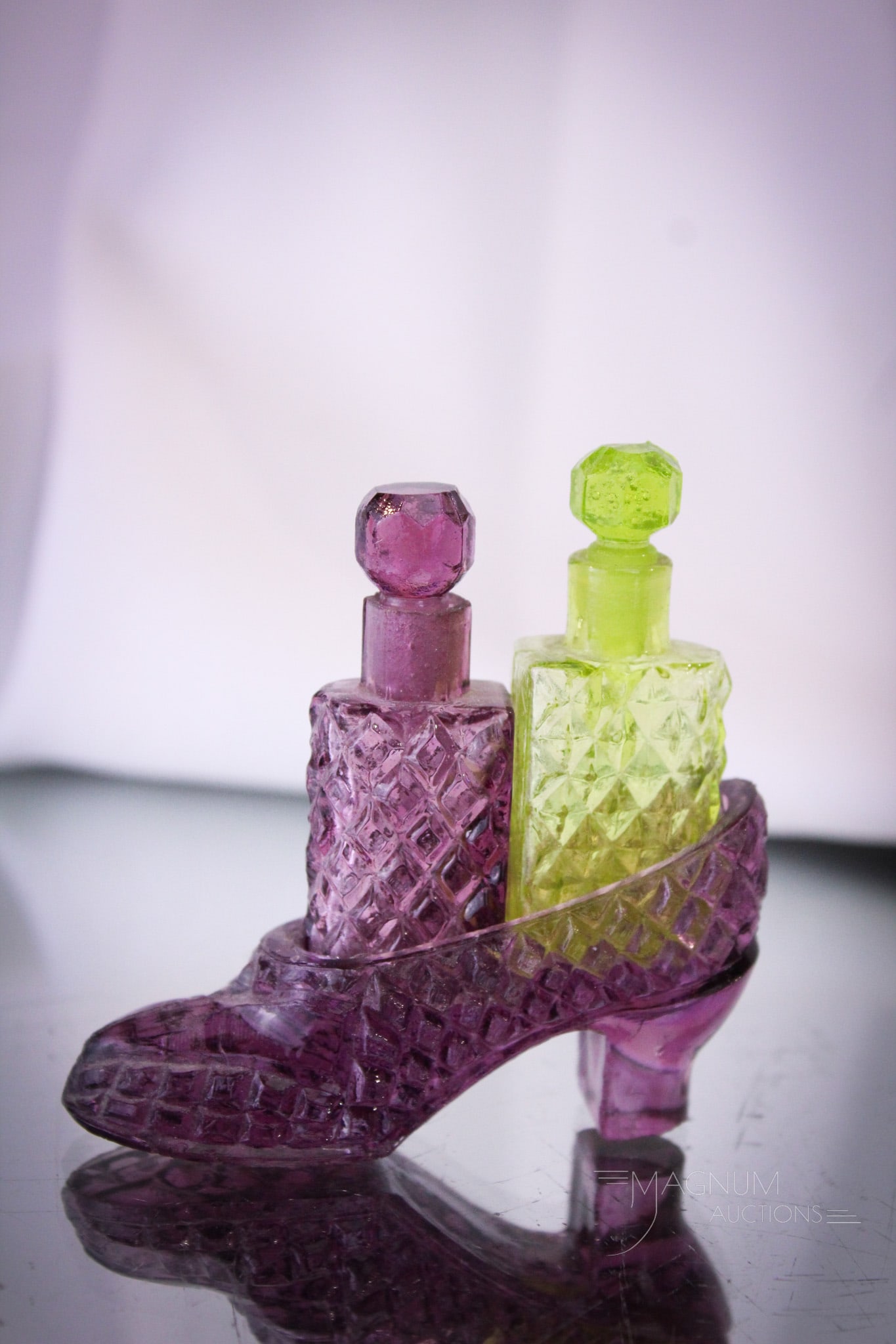 Teensy Tiny Figural Shoe Amythest Vaseline Perfume Set: Folks if you like them small, then this one's for you. Teensey tiny figural shoe perfume castor in amythest and vaseline glass.Each bottle complete with stopper and dauber.Complete set measures a tiny