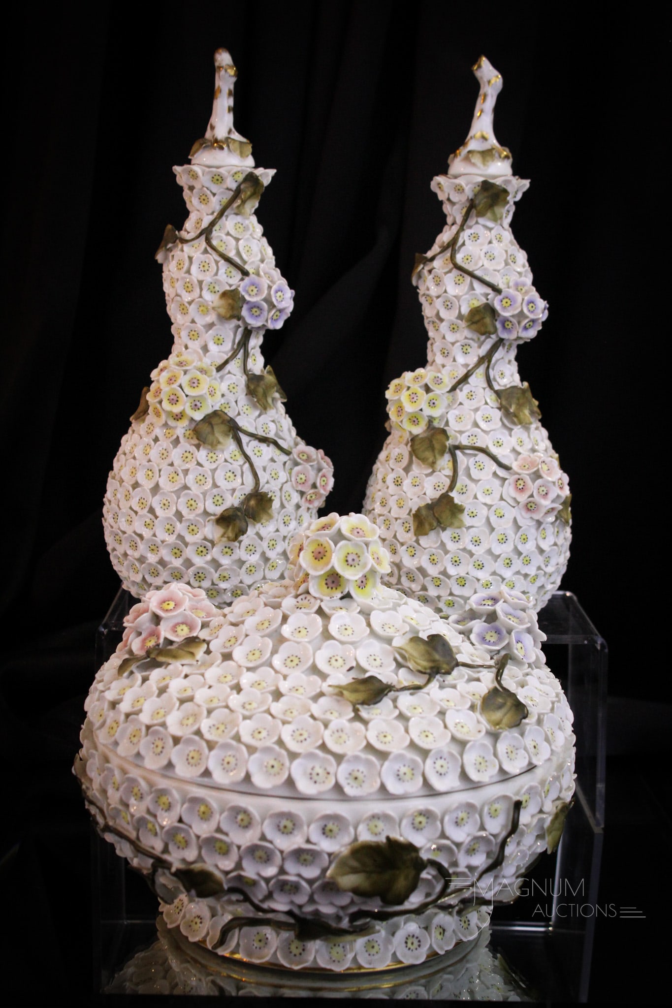 3 pc German Porcelain Cologne Dresser Vanity Set: Three piece cologne vanity dresser set in Meissen style German porcelain in Schnneballen design. Monumental set as each cologne measures 11" tall. The lidded jar measures 6 3/4" tall and 8" diameter. 