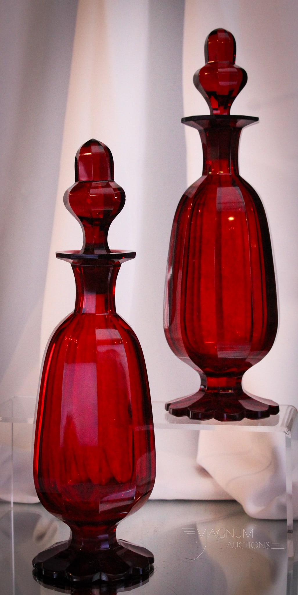 Beidermeier 12" Ruby Cut Glass Cologne Bottles: Gorgeous pair of Beidermeier cut ruby glass cologne bottles with heavy cut faceting. Each bottle measures 12" tall.