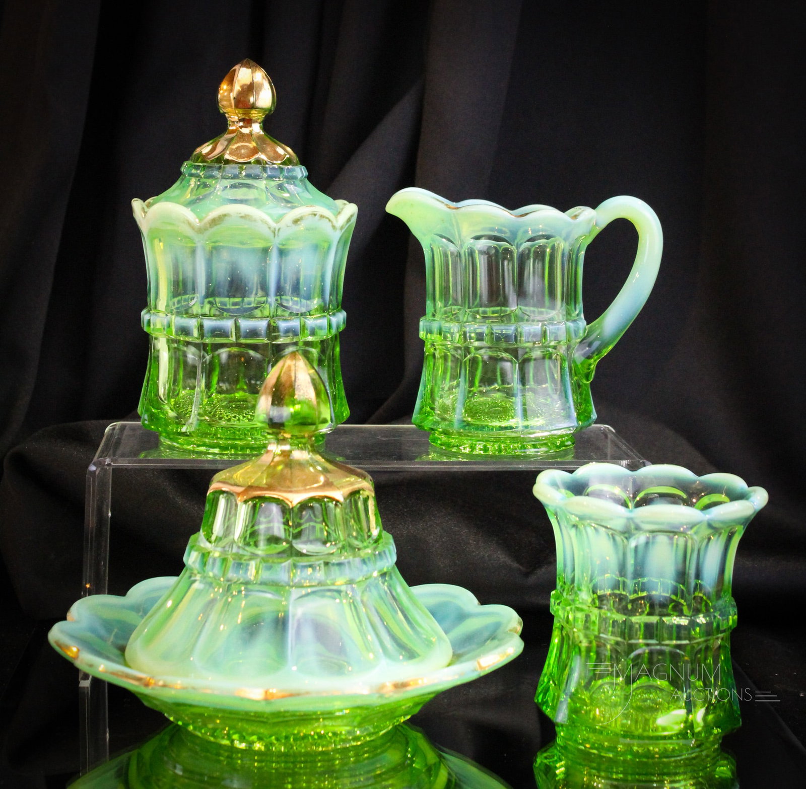 4 pc Northwood Regal Green Opalescent Victorian Table Set: Beautiful complete set of Northwood's green opalescent Regal pattern in a table set. This set embellished with gol. Nice example. Tallest measures 7". Sugar Base with chip to rim as shown.