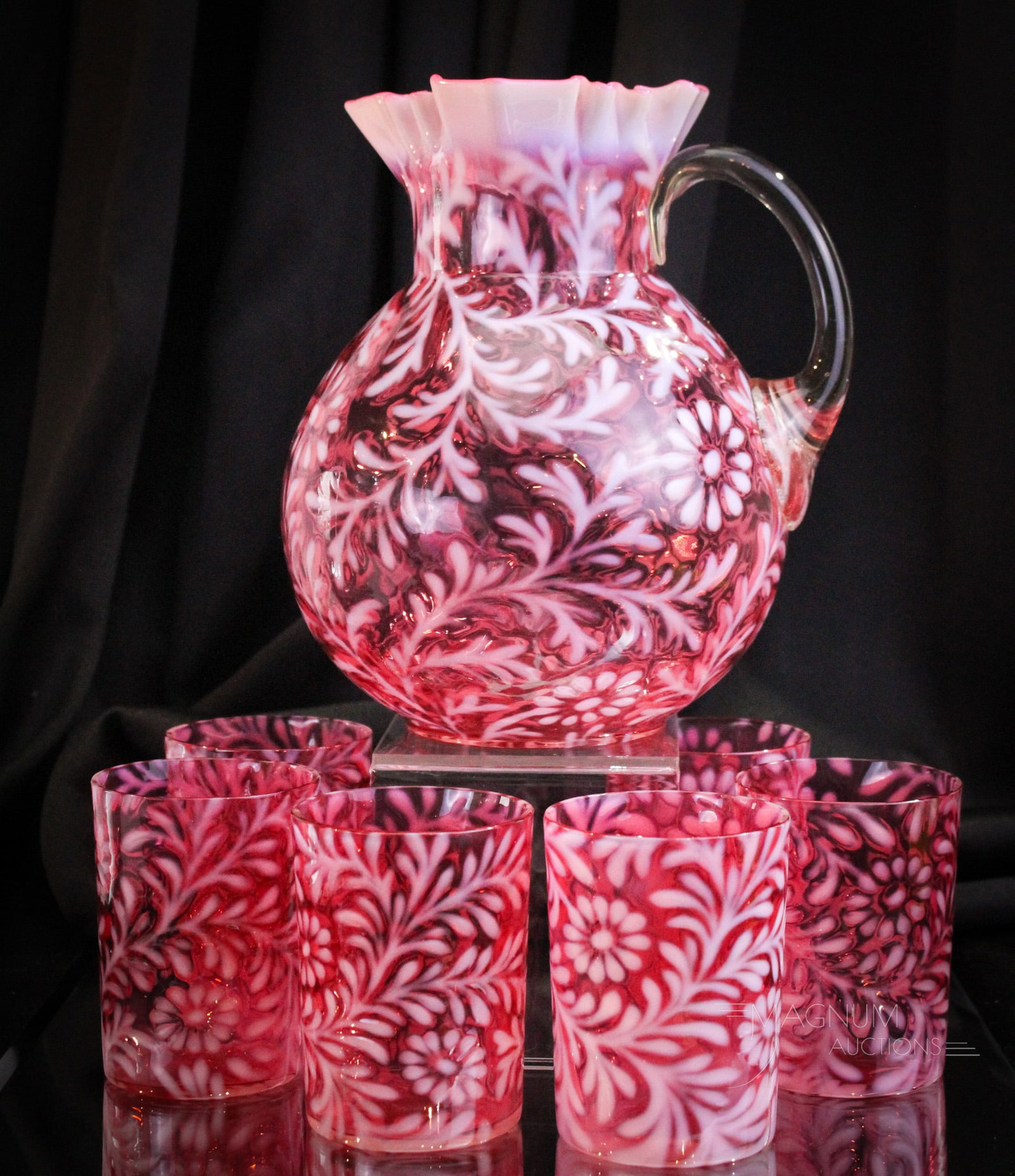 Northwood Cranberry Opalescent Daisy & Fern 7 pc. Water Set: Beautiful cranberry opalescent Northwood Daisy and Fern pattern Victorian water set. Set is comprised of pitcher and six tumblers. Nice set! Tallest measures 8 3/4". Provenance: This item is from the 