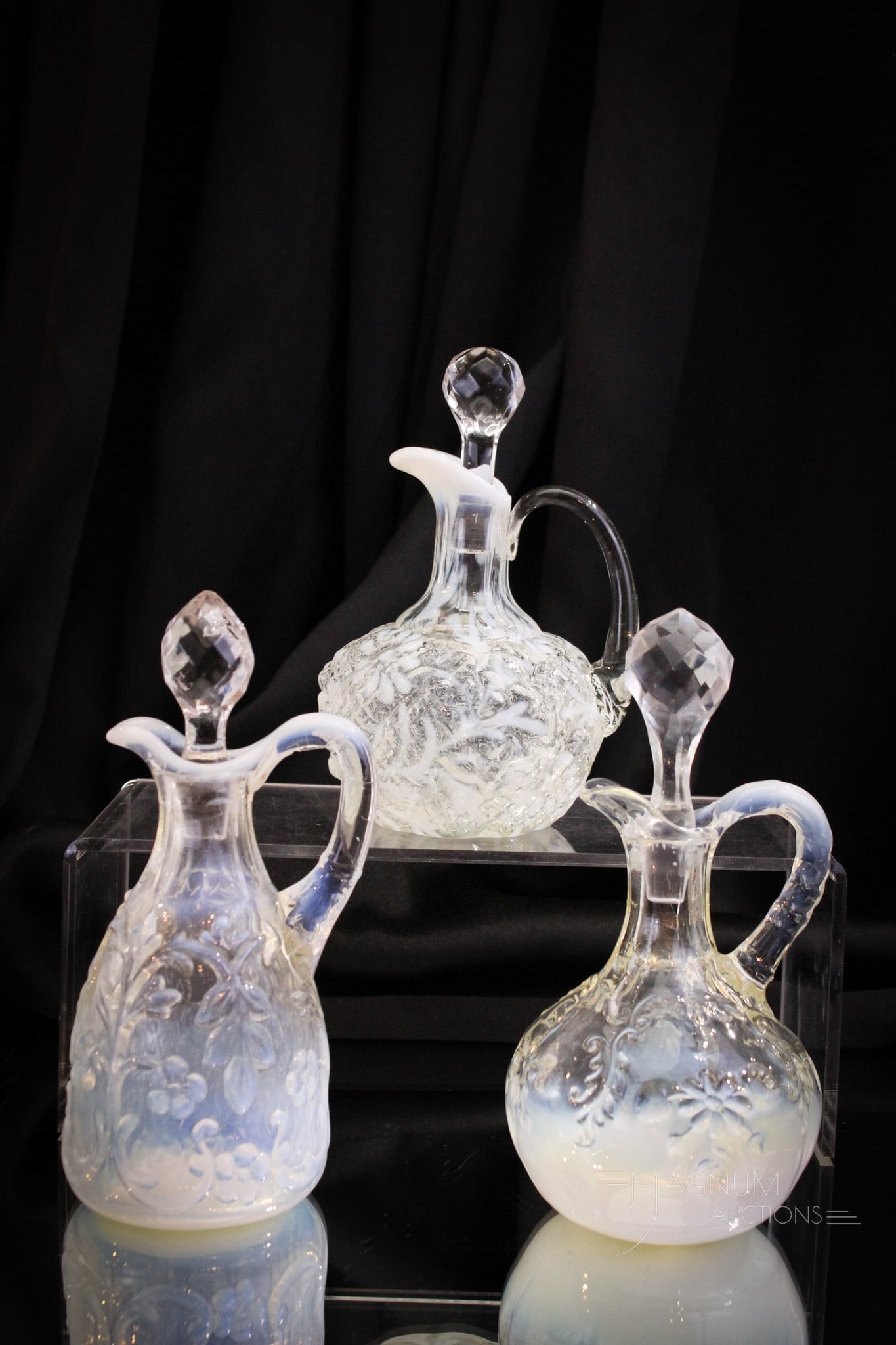 3 pc Lot Victorian Opalescent Glass Northwood & More Cruets: Three fine examples of Victorian opalescent glass cruets. Lot is comprised of a Flora pattern, an intaglio pattern by Northwood, and completed by a Daisy & Fern example by Northwood as well. Tallest m