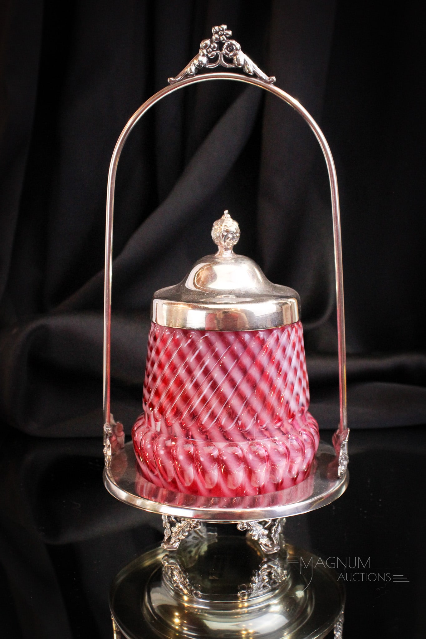 Cranberry Opalescent Northwood Victorian Silverplate Pickle Castor: Very showy Victorian silverplate pickle castor complete with Northwood cranberry Chrysanthemum Swirl pattern insert. Fine piece to grace your collection. It stands tall at 10 1/2". Silverplate is unsi