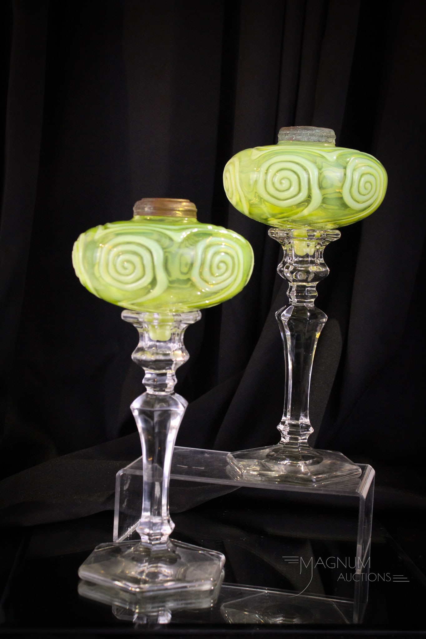 Pair Vaseline Opalescent Victorian Large Peg Lamp Candlesticks: Very unusual vaseline opalescent Victorian peg lamp fonts in associated candlsticks. Each of these fine fonts with an almost target swirl pattern. Candlesticks from a later period. Fine pieces. Each w