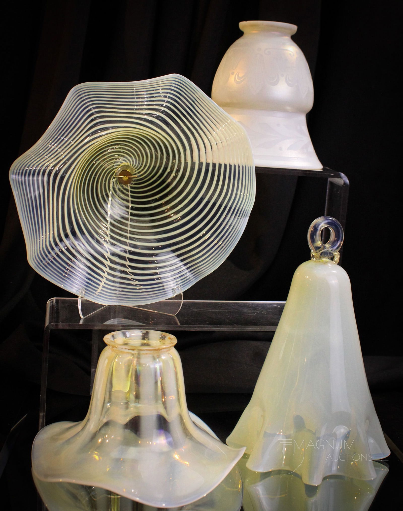 4 pc Lot Victorian Opalescent Vaseline Steuben & More Shades & Smoke Bells: Fine offering of four unique items. Lot is comprised by a butterscotch opal shade with a rib optic pattern. A Steuben engraved Calcite shade. Two smoke bells. One in vaseline oaplescent with a clear a