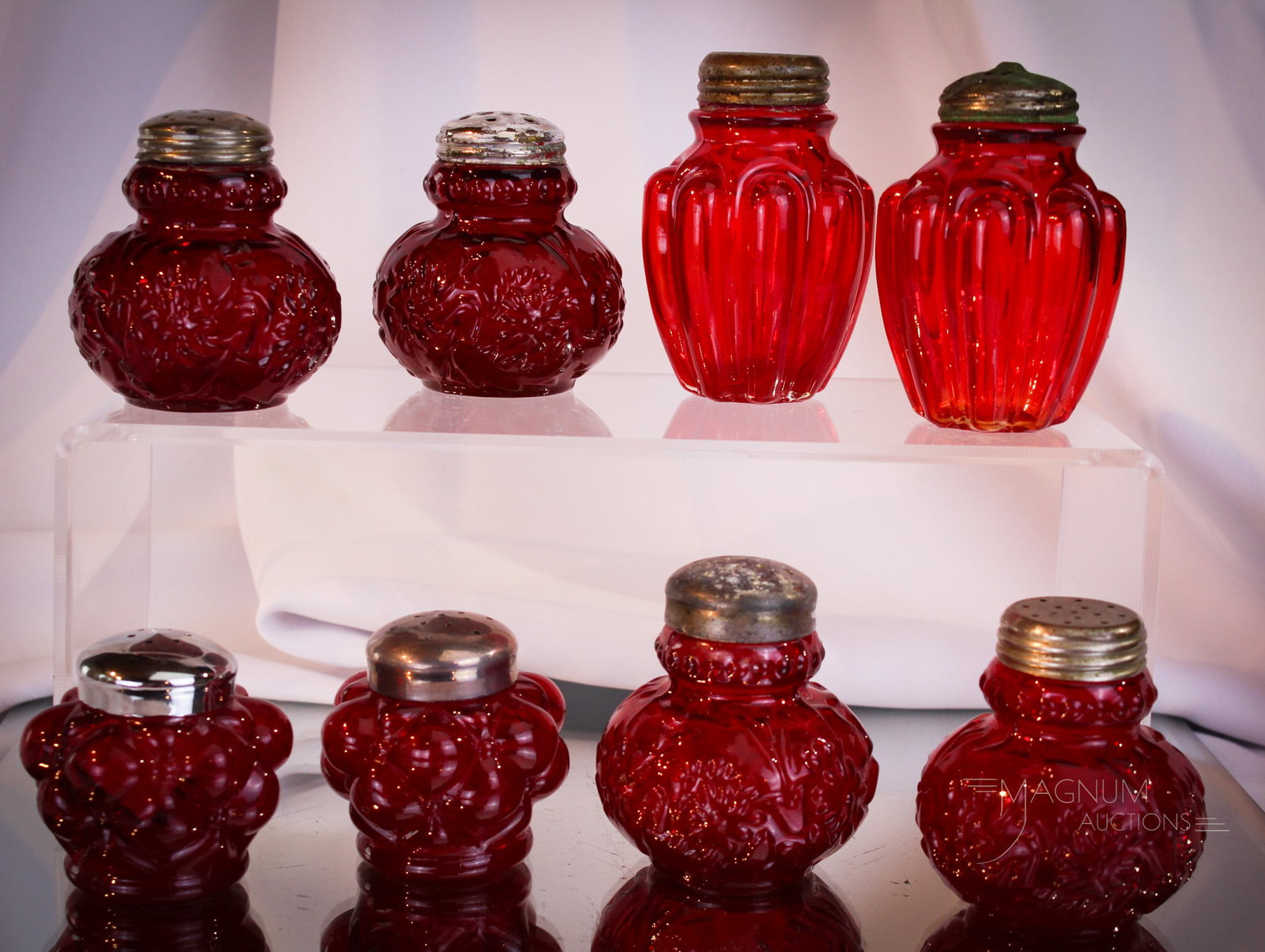 8 pc Lot Victorian Pigeon Blood Assorted Salt Shakers: Nice assortment here folks! Various patterns of the ever popular pigeon blood Victorian glass salt shakers. Tallest measures 3".