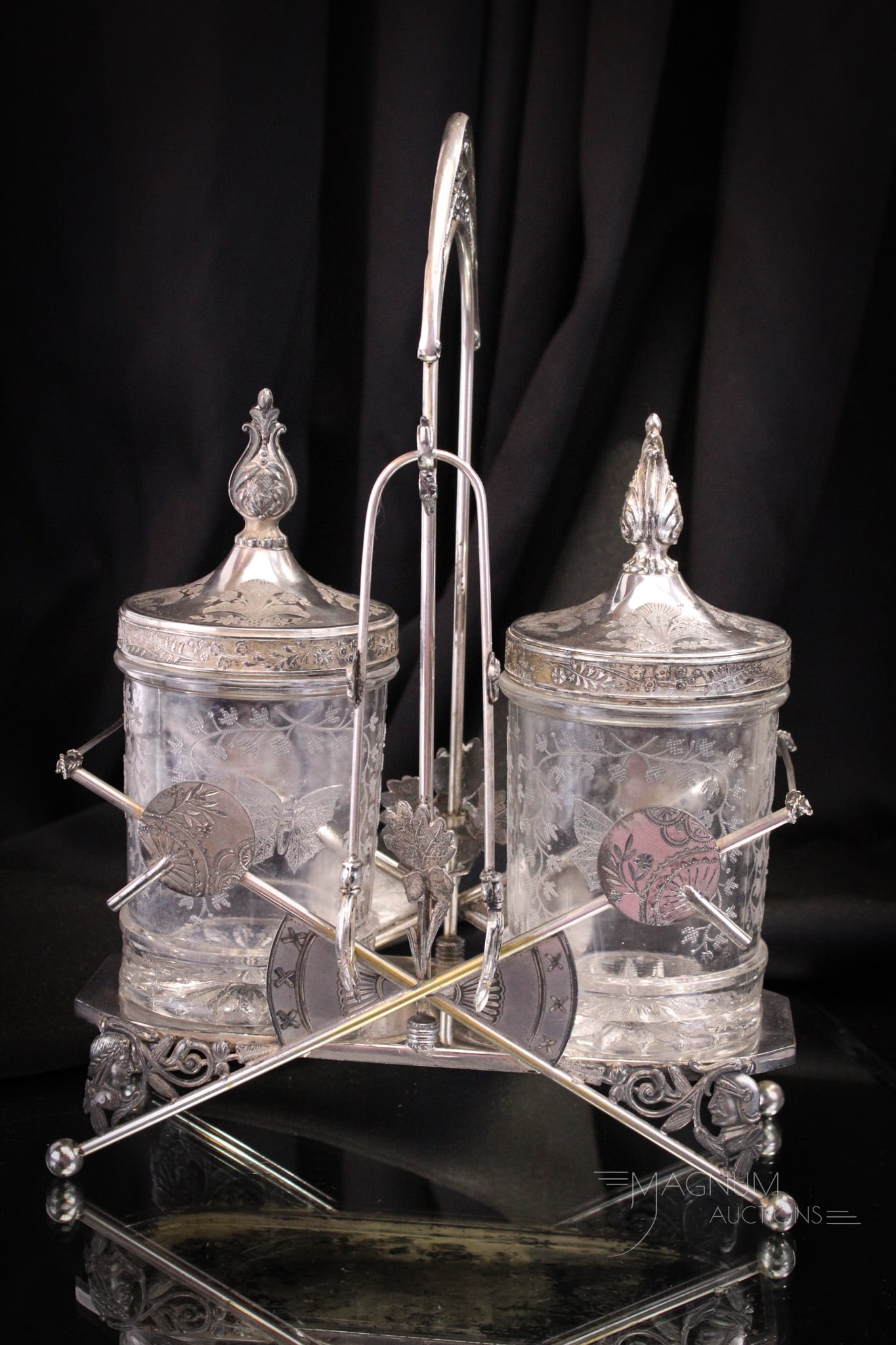 Meriden Silverplate Victorian Double Pickle Castor: Very fine Meriden signed Victorian double pickle castor complete with original inserts and lids. Piece features many interesting decorations including round Japanese fans and figural profile medallion