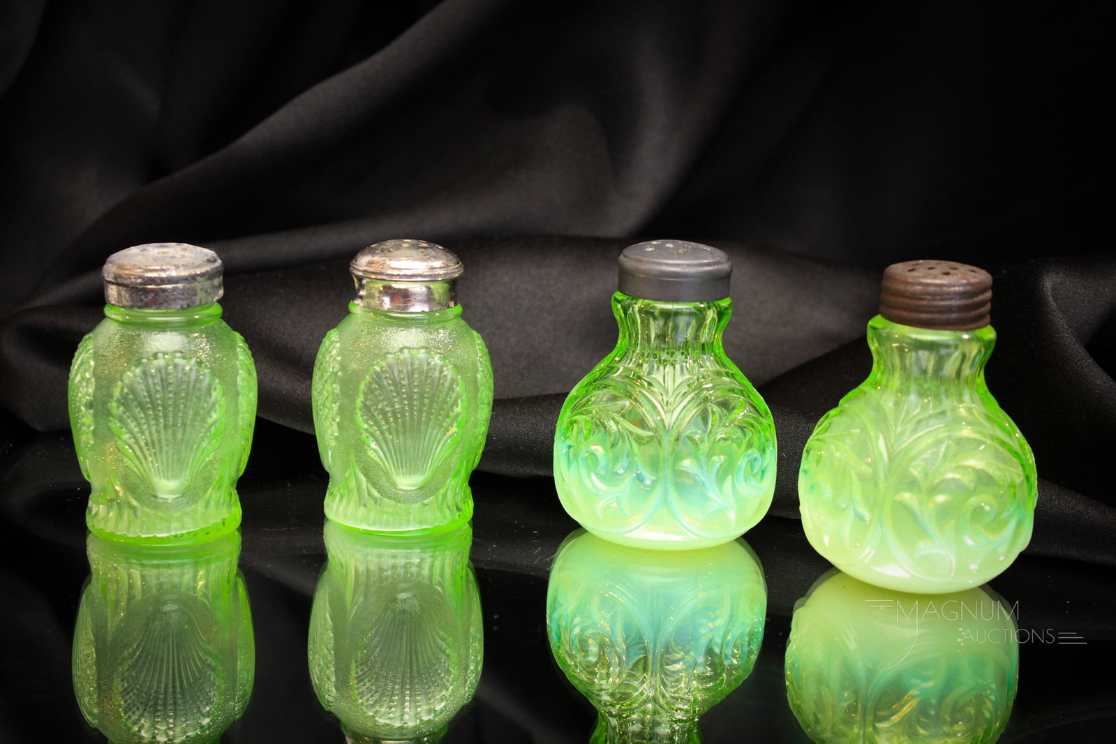 2 pairs of Northwood Green Opalescent Glass Salt Shakers Shell & Scroll: Mother Magnum's favorite color folks! Here we have two pairs of Victorian Northwood salt shakers in green opalescent glass. One pair is the Circle Scroll pattern. The other is a rare pair of Shell sha