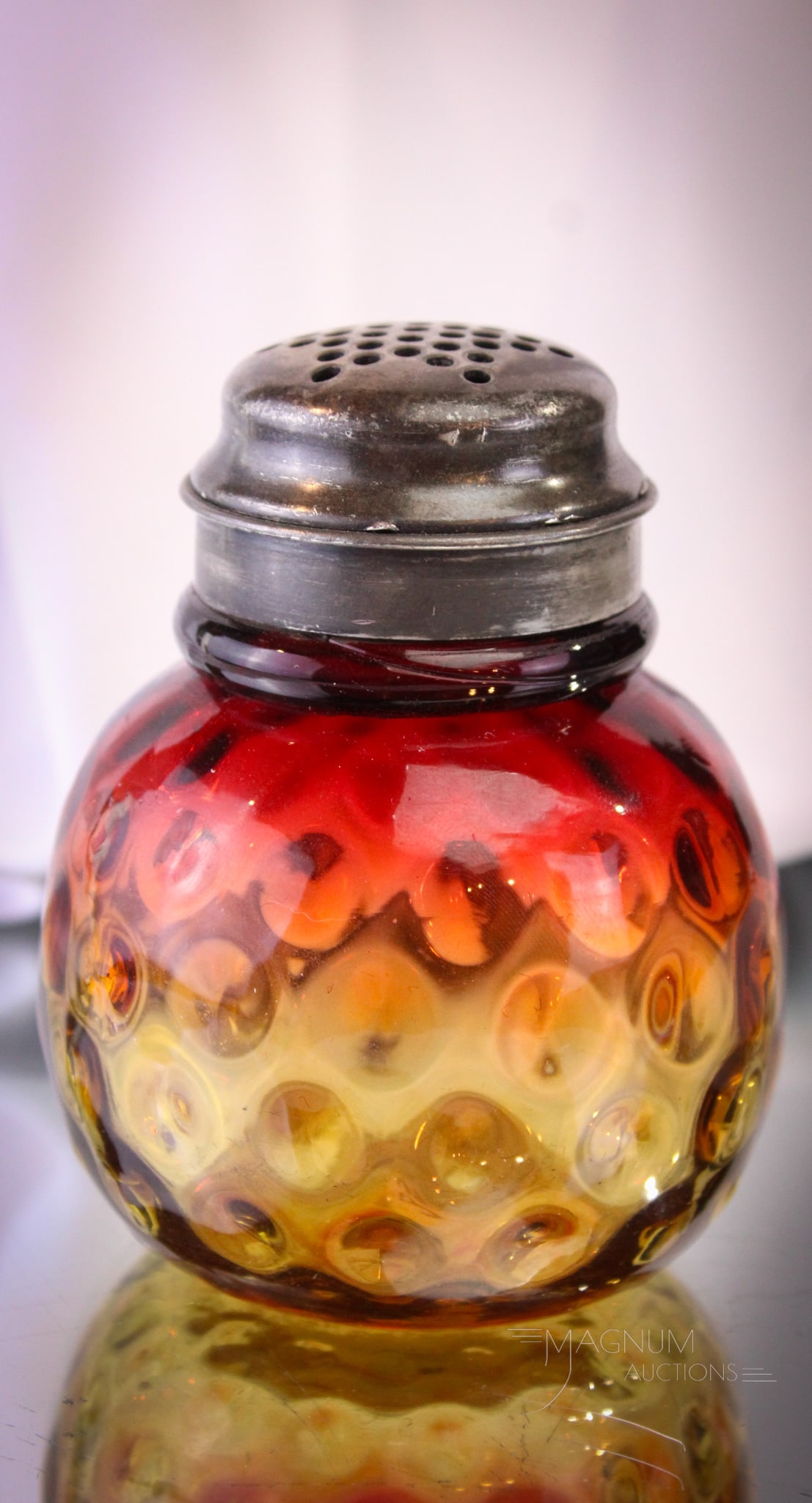 Rare Mt. Washington Amberina Victorian Glass Sugar Shaker: Beautiful and rare find in this Mt. Washington glass sugar shaker. Shaker has excellent coloring and comes complete with two-piece top. Nice! It stands at a short 4" . Provenance: This item is from th