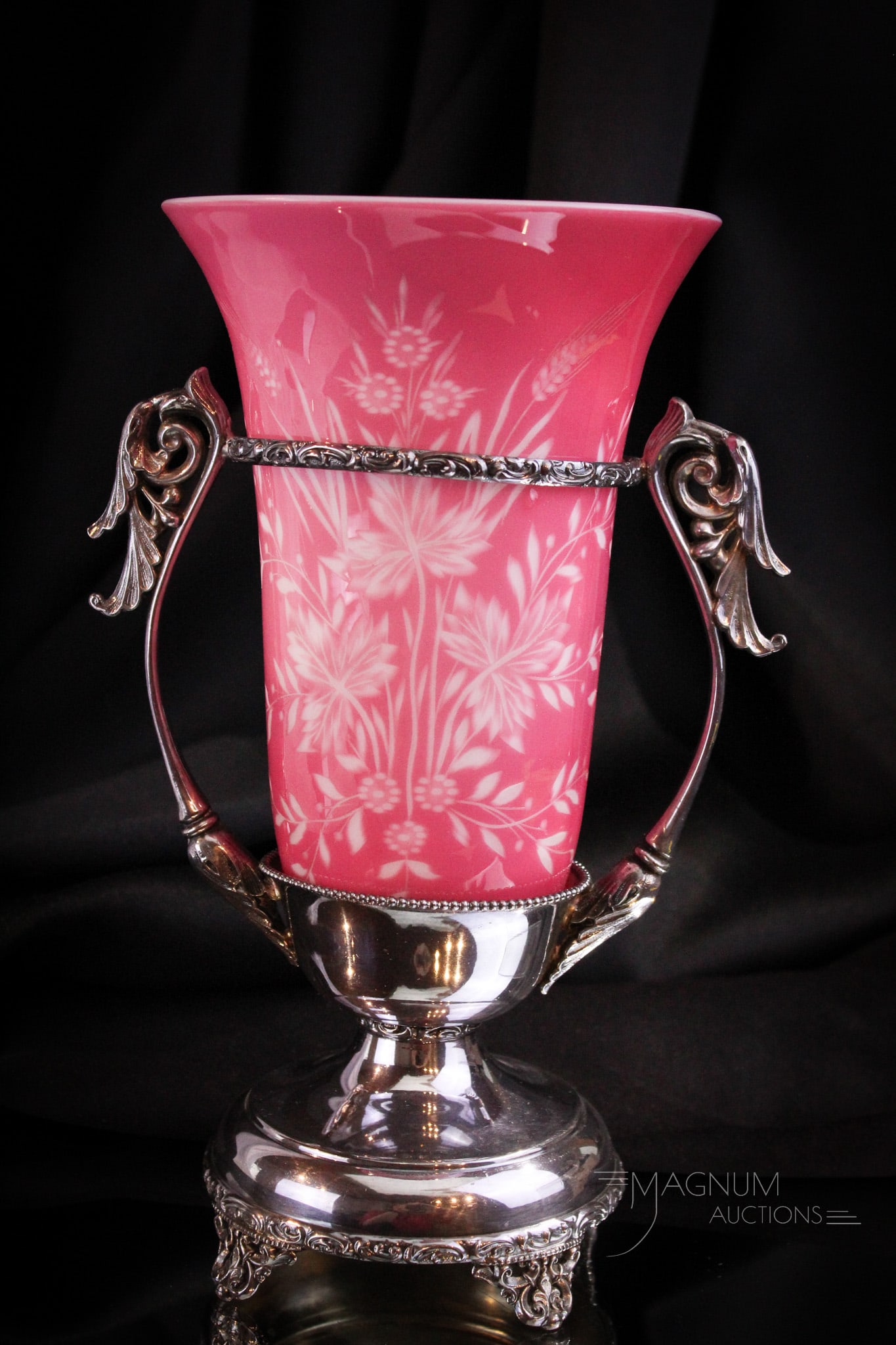Forbes Victorian Silverplate Intaglio Cut Stevens Williams Celery Vase: Beautiful Victorian signed Forbes silverplate holder embracing a Stevens & Williams pink cased Intaglio cut celery vase. Piece measures 10" tall.