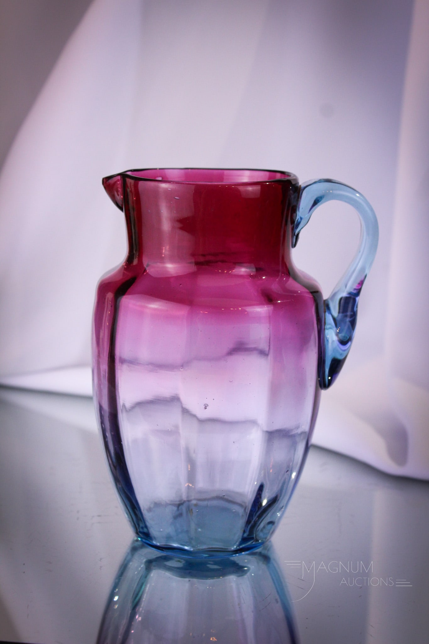 Victorian Bluerina Art Glass Milk Pitcher: Nice seldom seen example of bluerina Victorian glass. This is a milk pitcher with rib optic pattern to the body. It measures a tall 6".