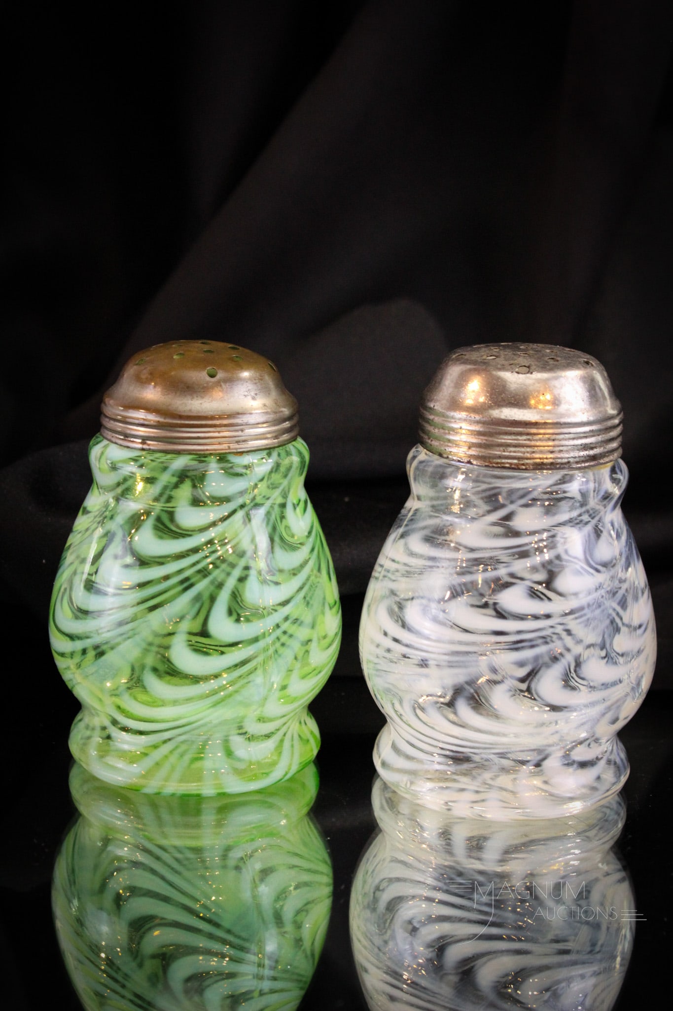 2 pc Lot Victorian Opalescent Glass Blown Twist Sugar Shakers: Double your buying pleasure and feed your addiction to collecting with this lot of two Victorian glass sugar shakers in the Blown Twist pattern. One in green and one in crystal opal. Tallest measures 