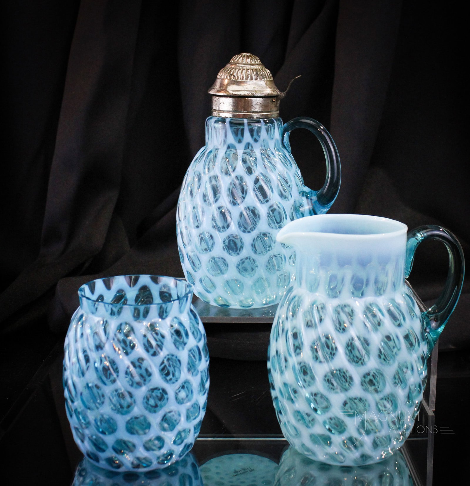 3 pc Lot Blue Opalescent Big Windows Syrup Creamer & Spooner: Three perfect examples of the ever-popular Big Windows pattern in blue opalescent glass. Lot is comprised by a syrup, along with a spooner and creamer. Tallest measures 6 3/4".