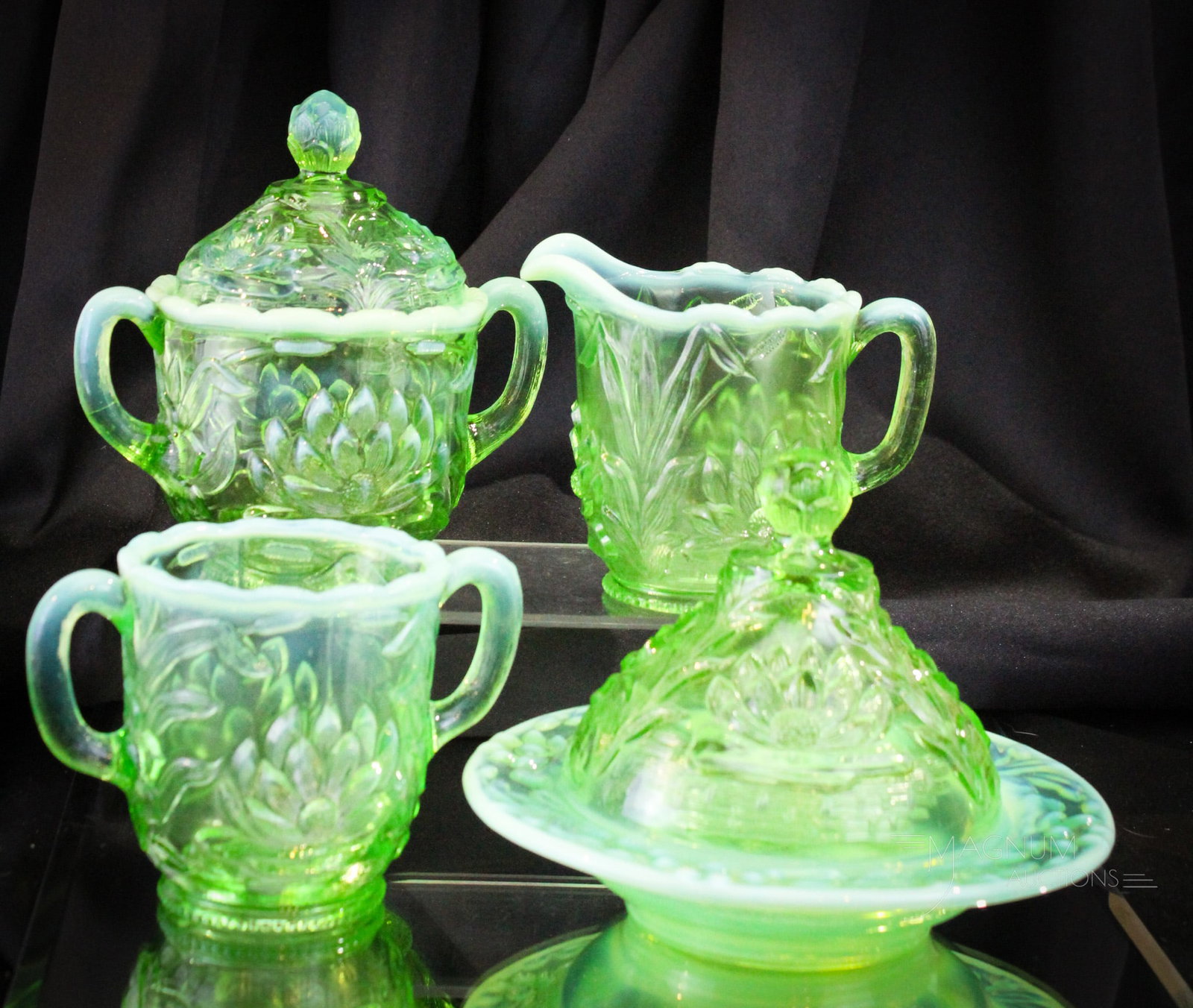 4 pc Fenton Green Opalescent Water Liliy & Cattails Table Set: Four excellent examples of Fenton's water Lily and Cattail pattern in green opalescent glass. Each piece with super color and opal. This four-piece set is a must have! Tallest measures 6 1/2".