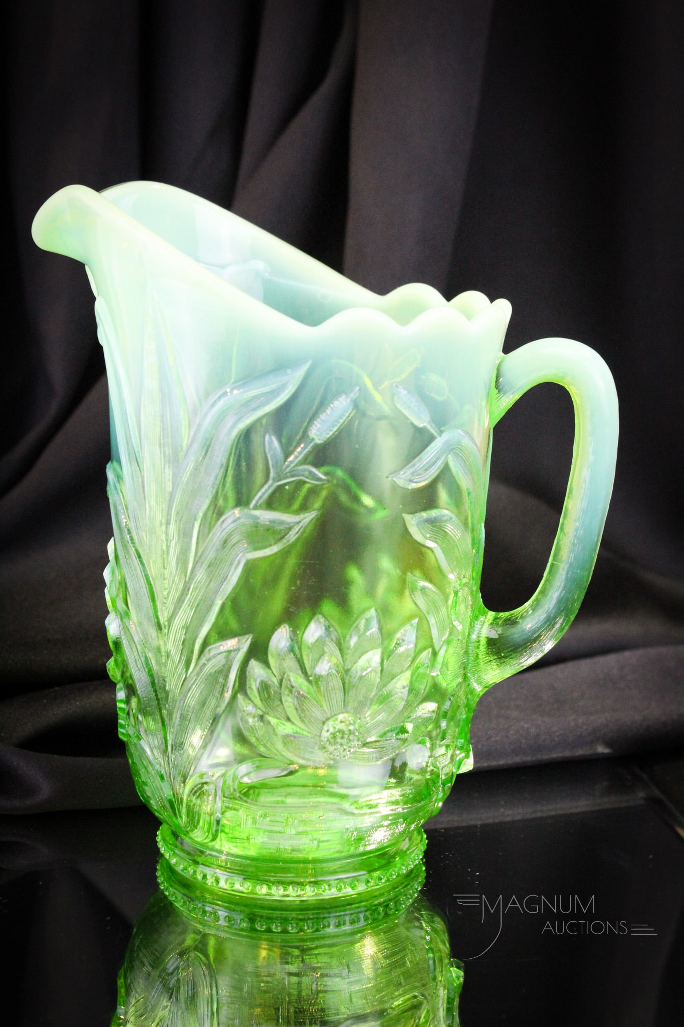 Fenton Green Opalescent Water Lily & Cattail Victorian Glass Pitcher: Brilliant example of a Fenton Water Lily and Cattail pattern pitcher. Green opalescent at it's finest here folks! This pitcher measures 9" tall of pure heaven