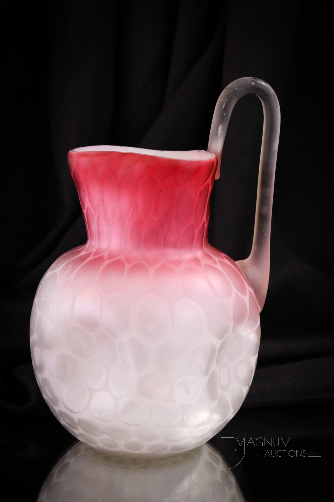 Phoenix Raindrop Mother of Pearl Satin Glass Victorian Pitcher: Gorgeous Victorian water pitcher attributed to Phoenix glass. This example comes complete with pulled up high handle. Fine coinspot pattern. Pitcher stands tall at 9 3/4" high.