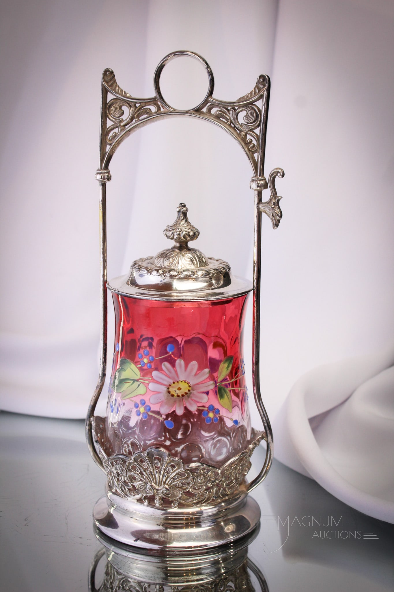 Homan Victorian Rubina Cranberry Enameled Pickle Castor: Fine signed Victorian Homan silverplate pickle castor complete with cranberry enameled rubina glass insert. Great example with super coloring. Castor measures 10 1/2" tall.