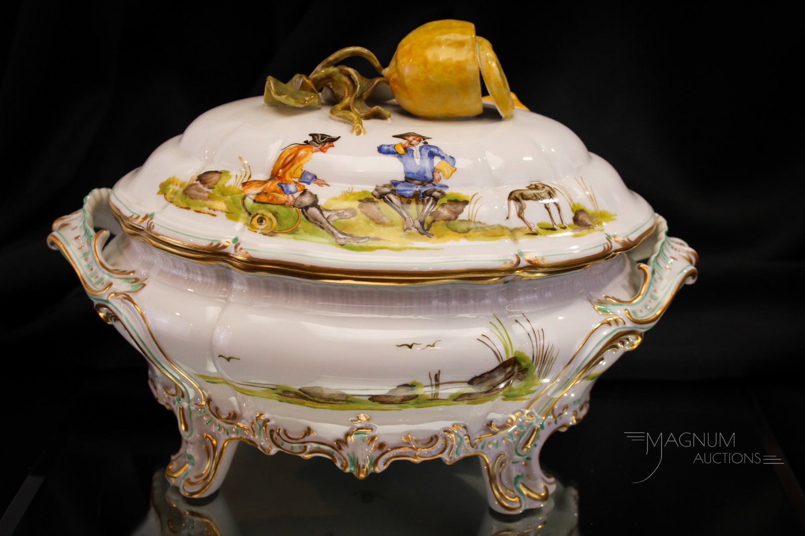 Signed Nymphenburg Porcelain Covered Vegetable Dish: Fine example of a signed Nymphenburg porcelain covered vegetable dish with figural lemon on the top and scenic decoration. Piece measures 7 1/2" tall, 10 1/2" long.