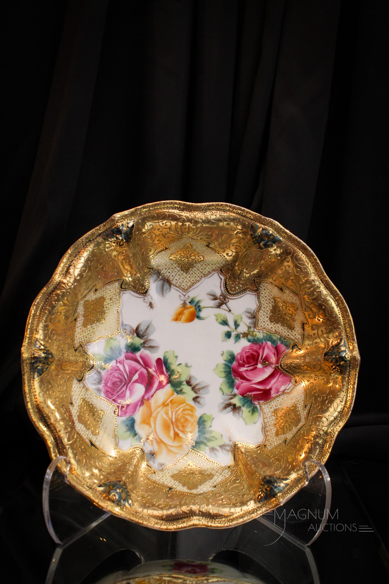 Marked Nippon Porcelain 11" Roses Bowl: Marked Nippon porcelain 11" bowl decorated with an abundance of roses and gilt work around. Bowl measures 2 1/2" tall, 11" in diameter.
