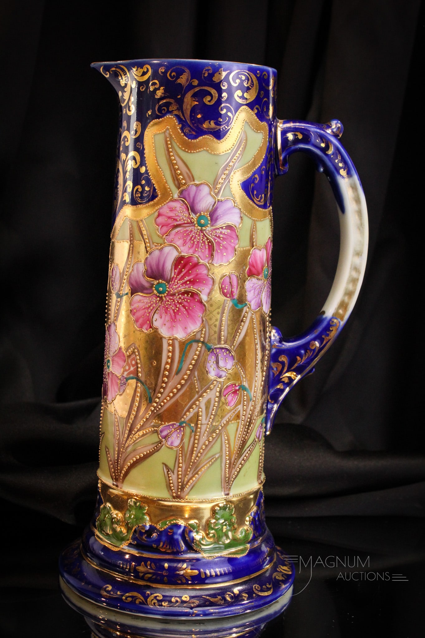 Unmarked Nippon Cobalt & Pansy Decorated Tankard Pitcher: Vibrant cobalt blue and pansy decorated tankard pitcher in unmarked Nippon porcelain. Gorgeous pitcher with lots of gilt work. Piece measures 12" tall.